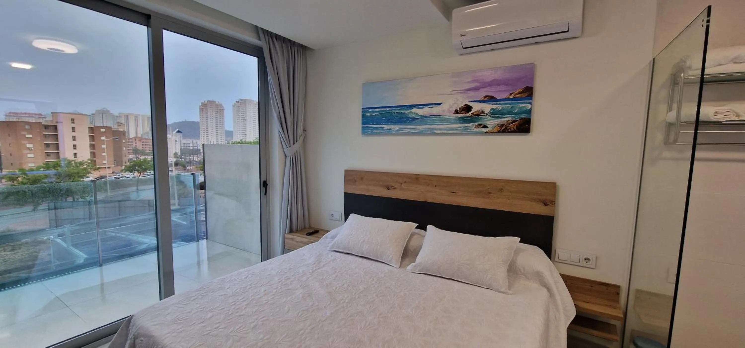 Bed in APARTAMENTOS OASIS DE LA CALA