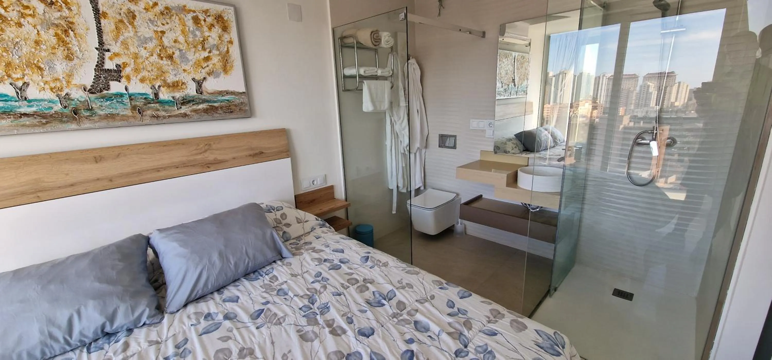 Bed in APARTAMENTOS OASIS DE LA CALA