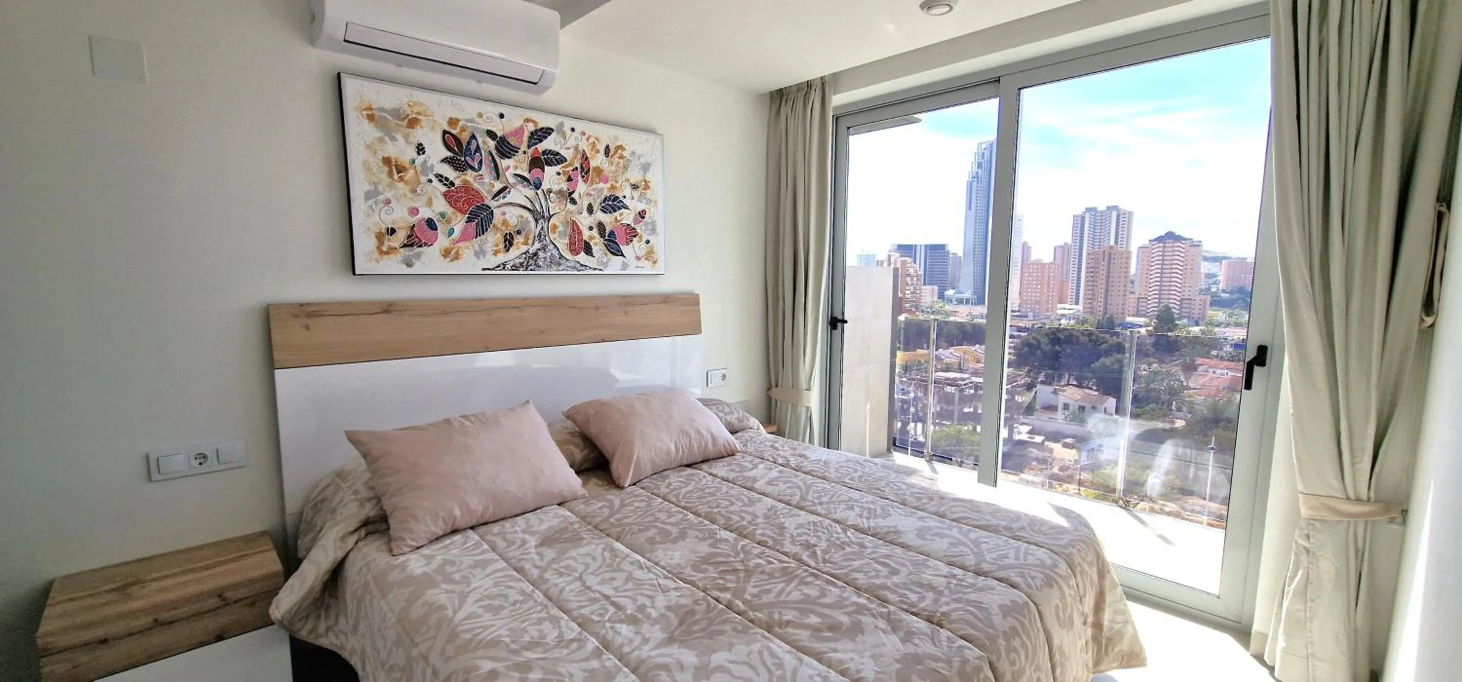 Bed in APARTAMENTOS OASIS DE LA CALA