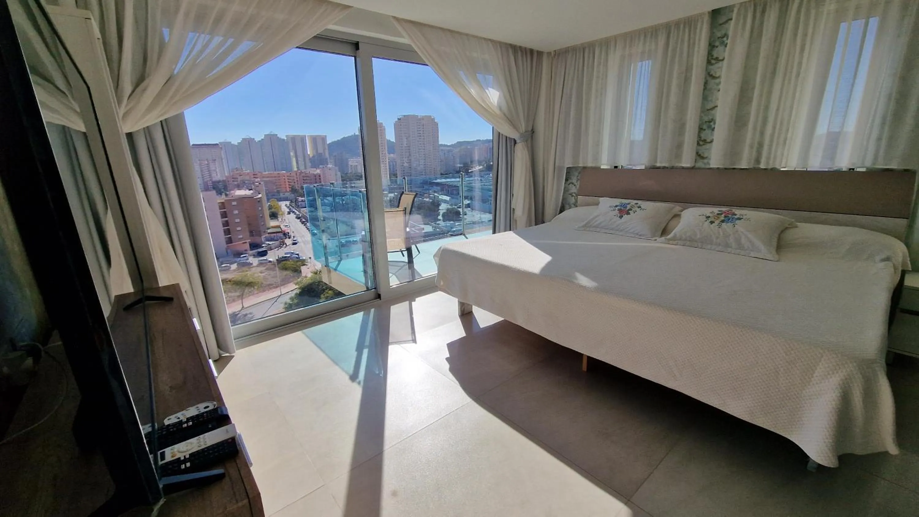 Bed in APARTAMENTOS OASIS DE LA CALA