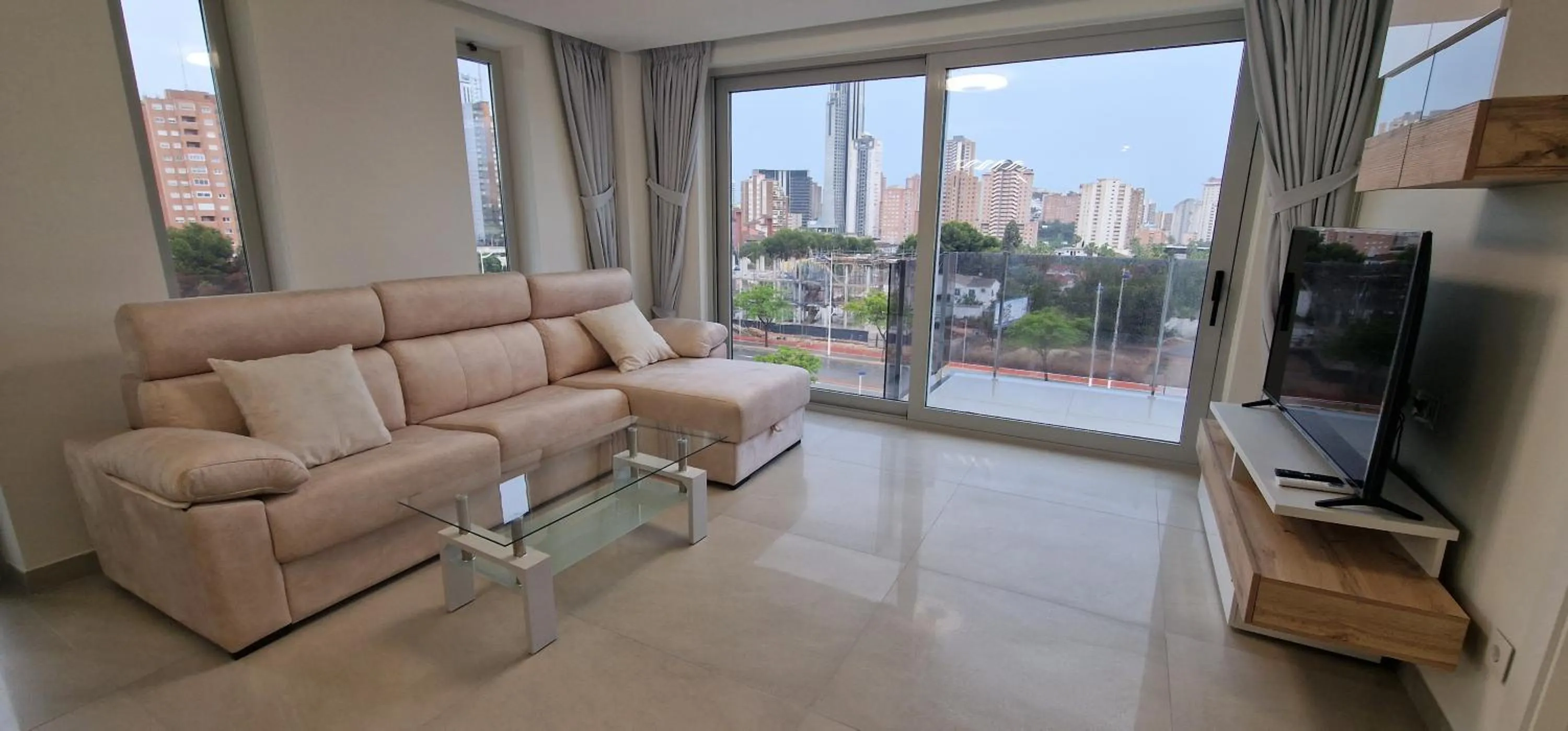 Communal lounge/ TV room in APARTAMENTOS OASIS DE LA CALA