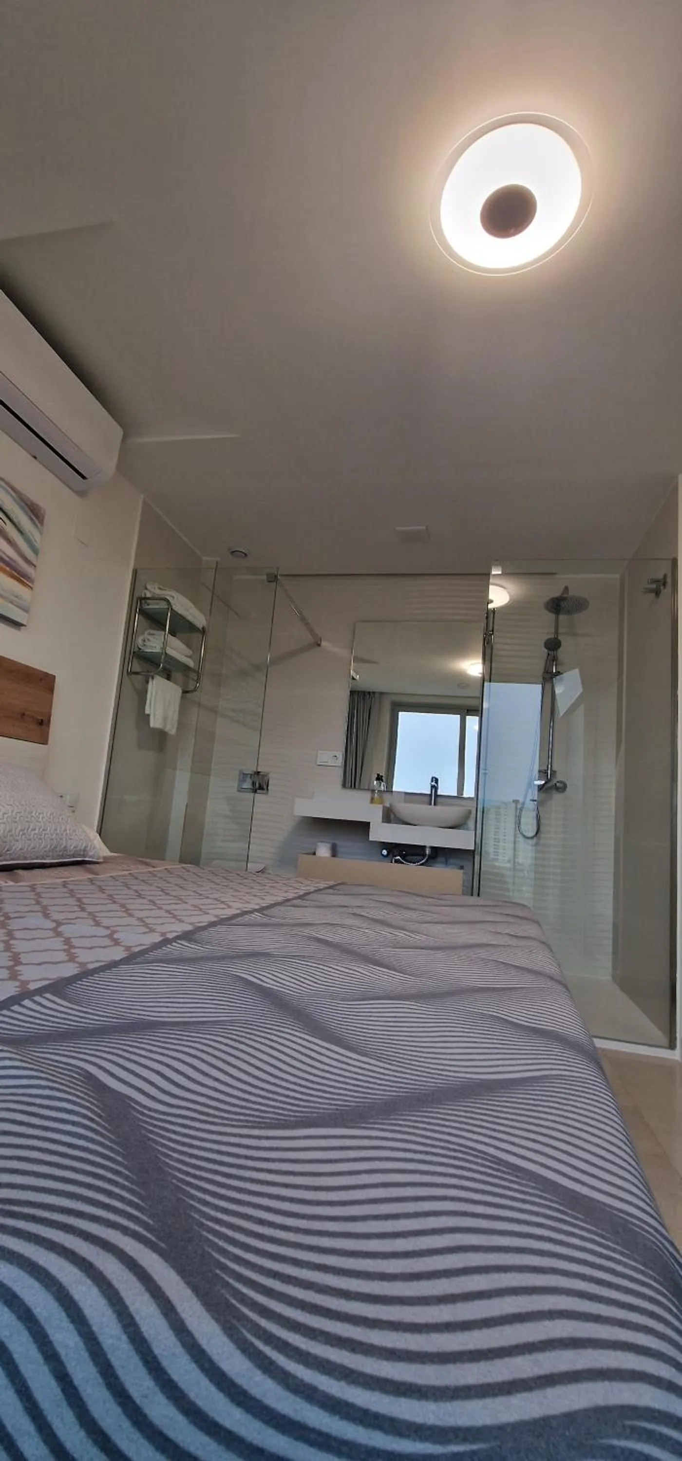 Bed in APARTAMENTOS OASIS DE LA CALA