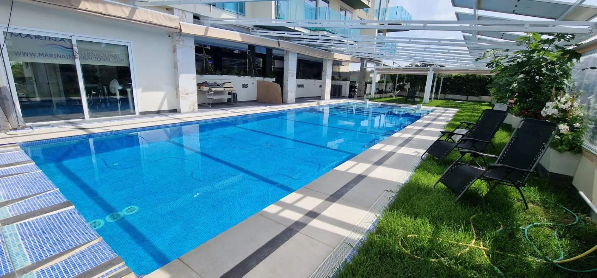 Swimming pool in APARTAMENTOS OASIS DE LA CALA