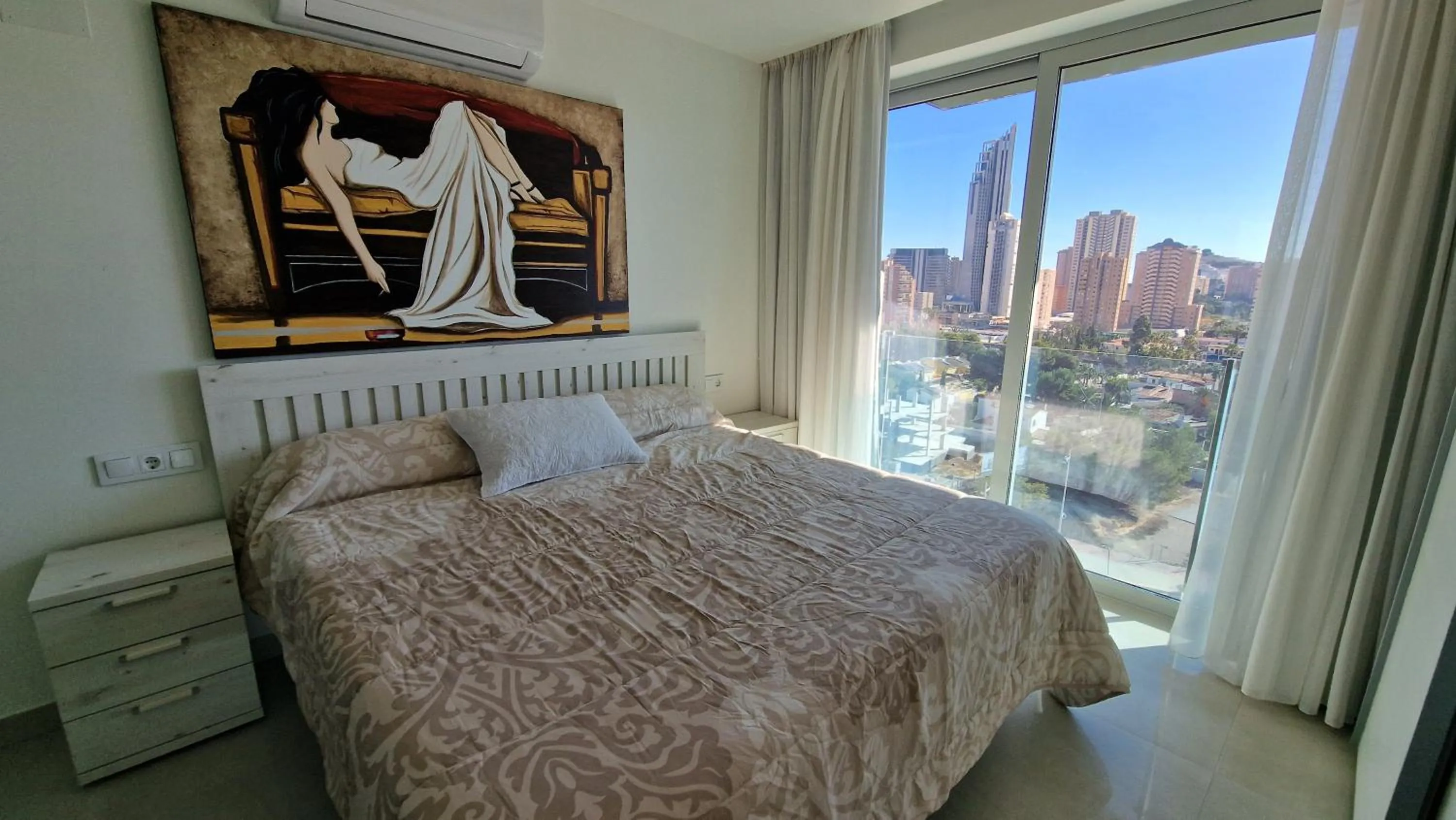 Bed in APARTAMENTOS OASIS DE LA CALA