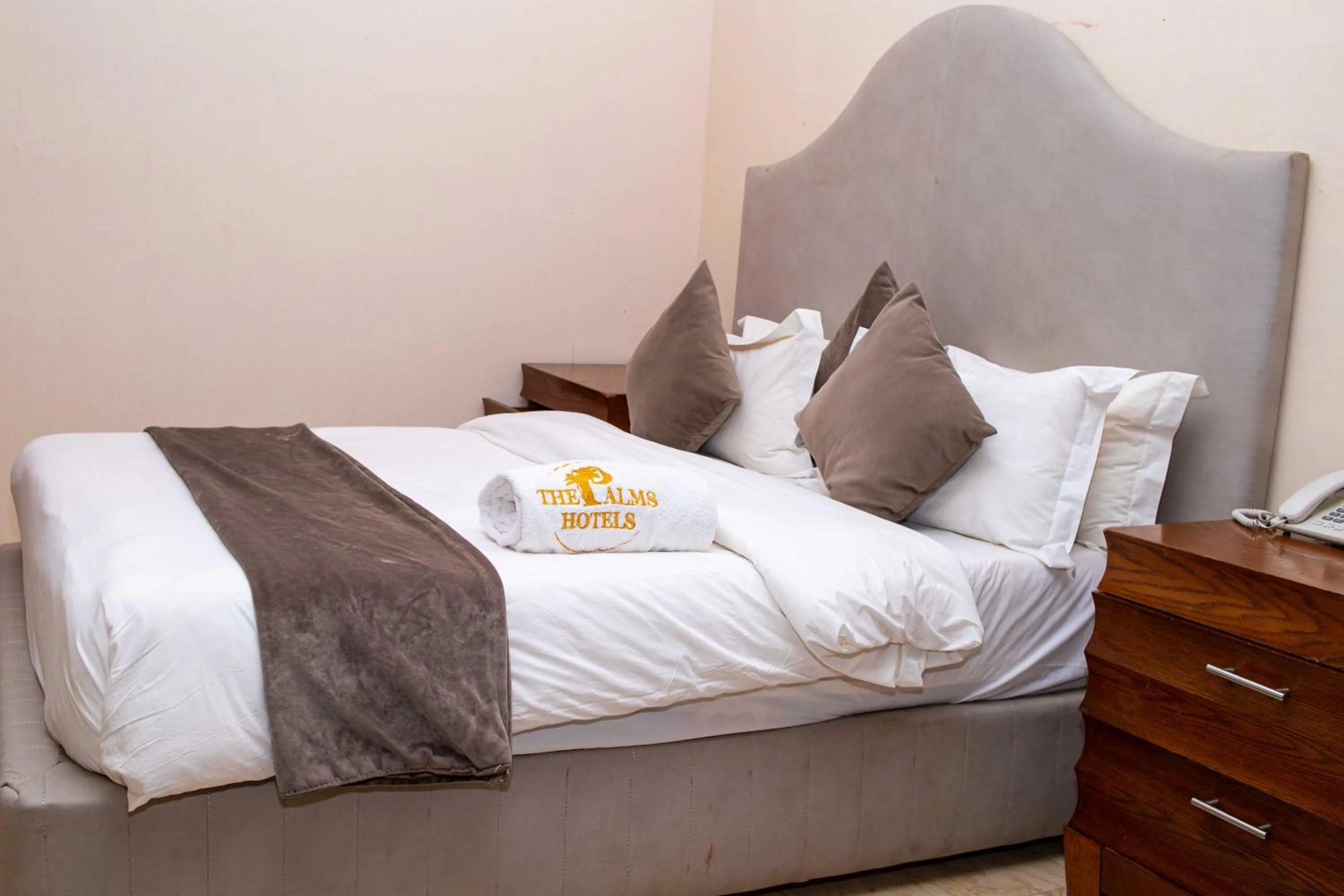 Bed in The Palms Hotel