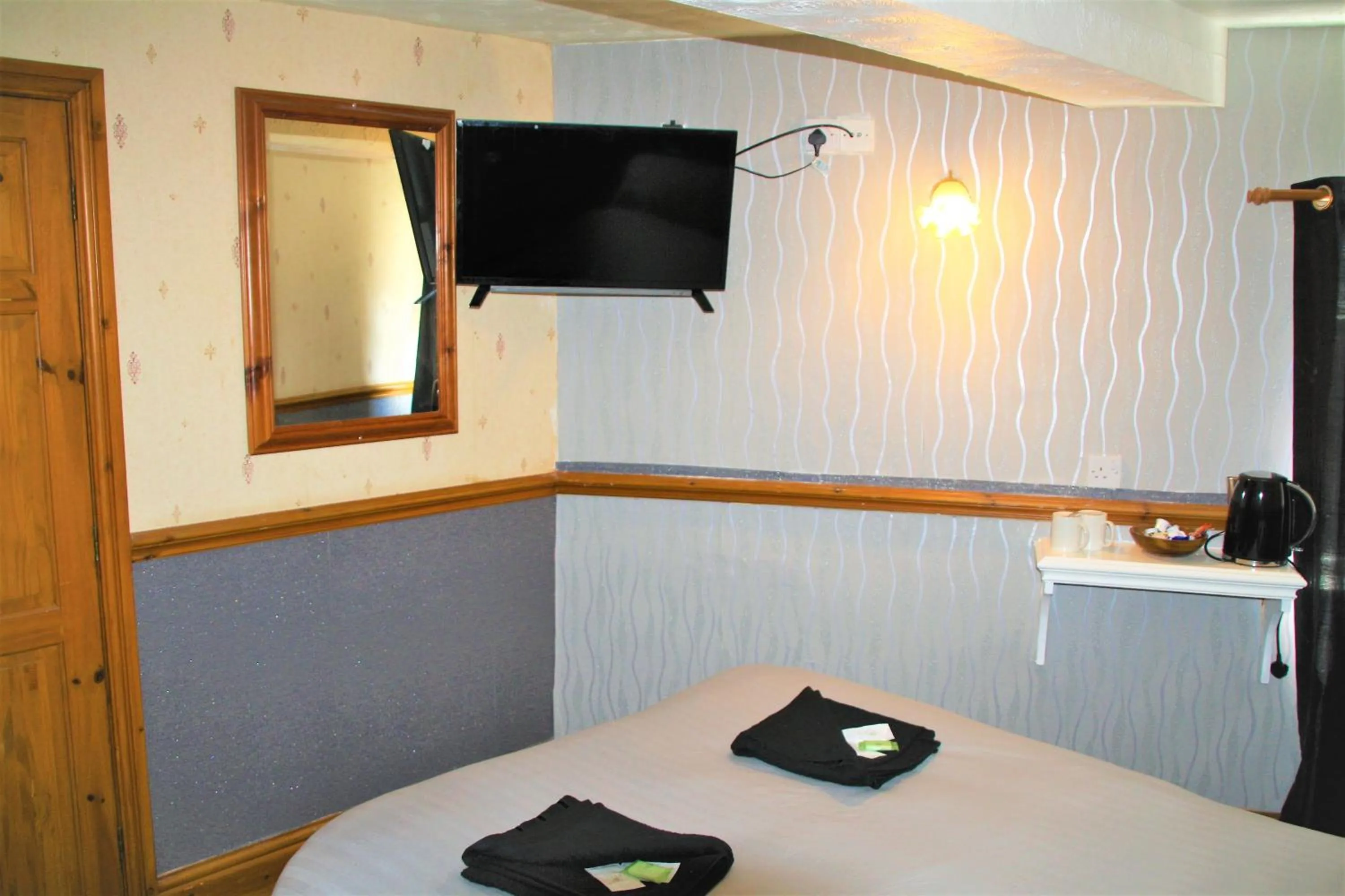 Bed in Pine Lodge Hotel