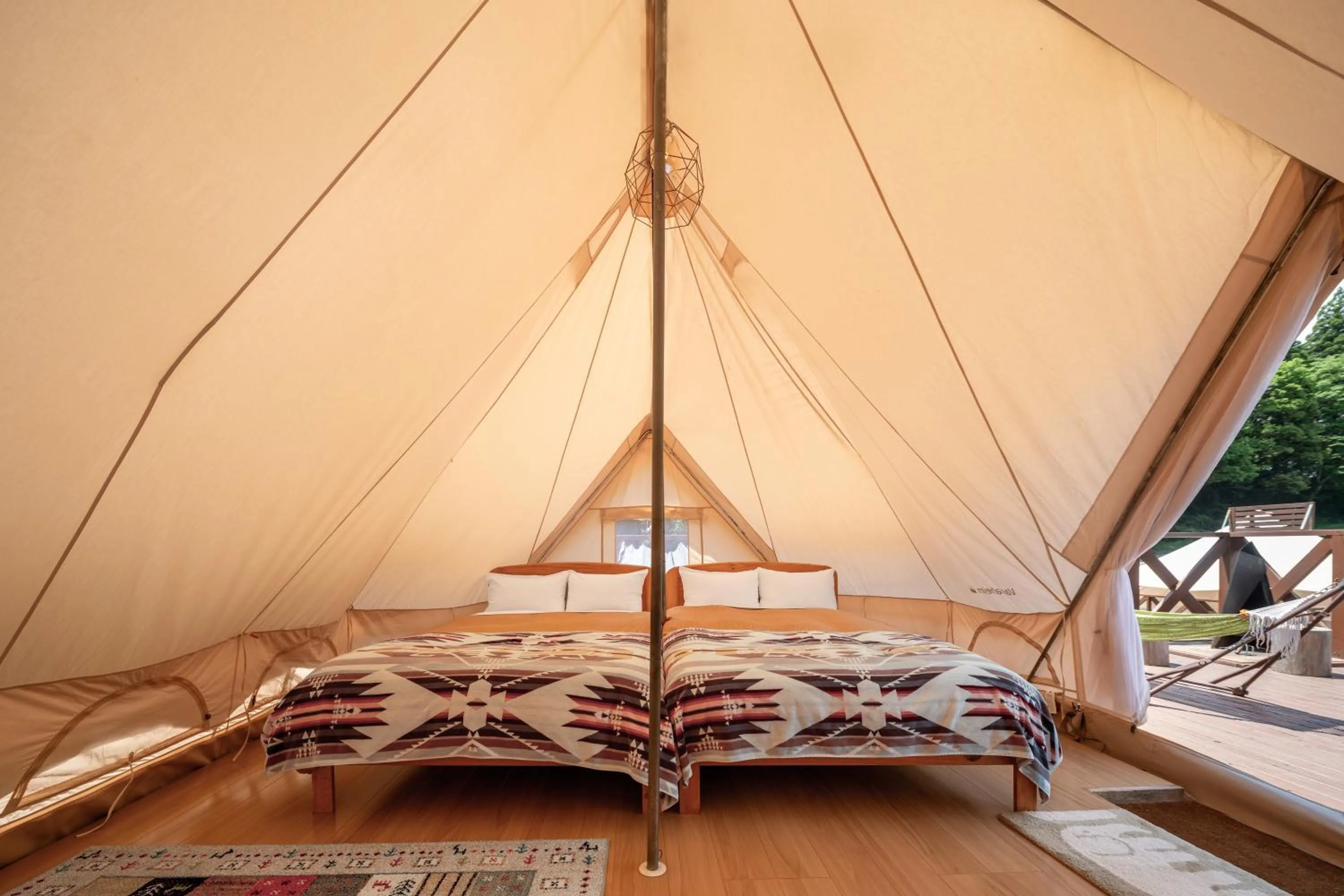 Bed in THE FARM Resort Japan