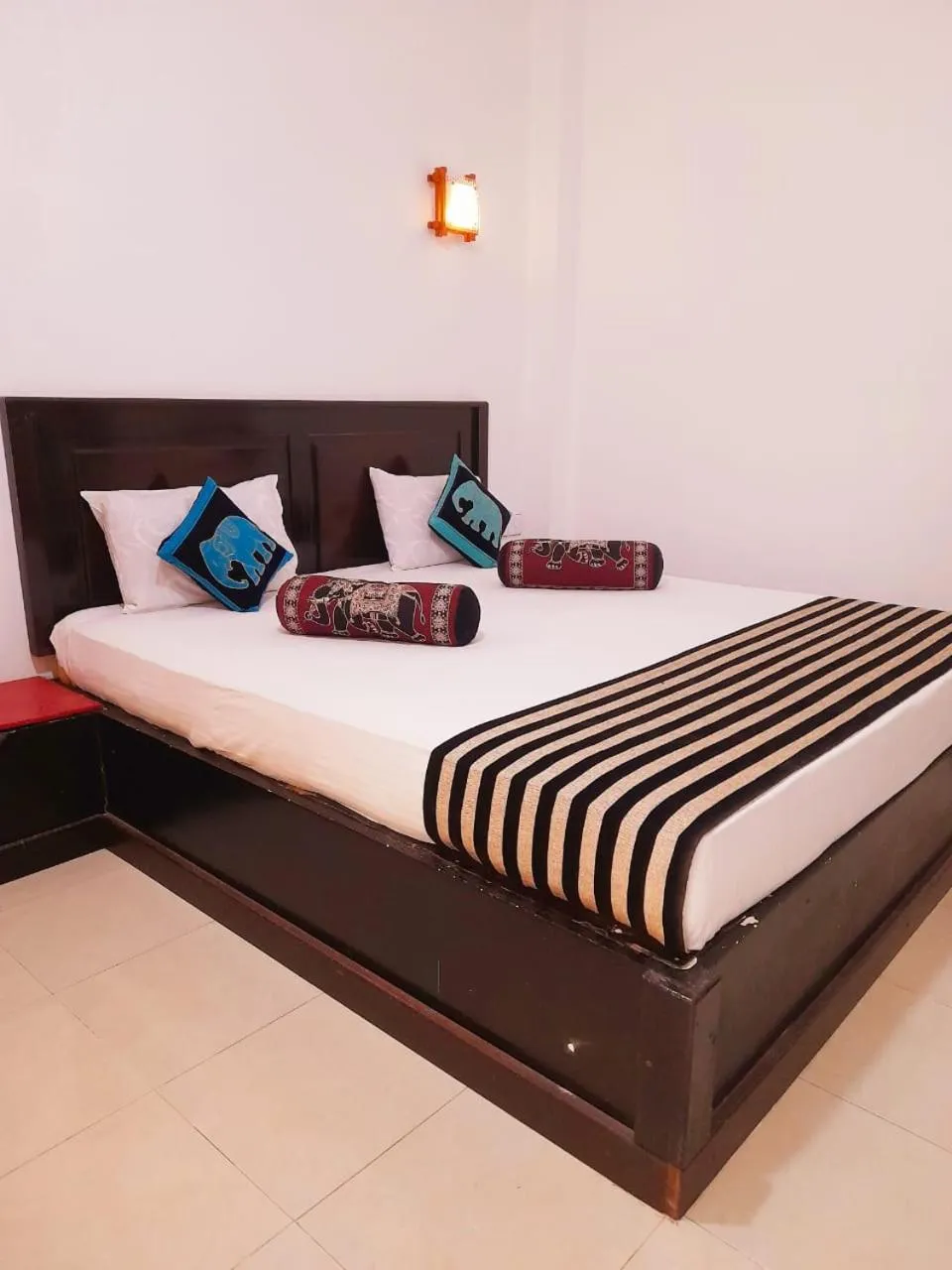 Bed in Heritage Rangiri Villa