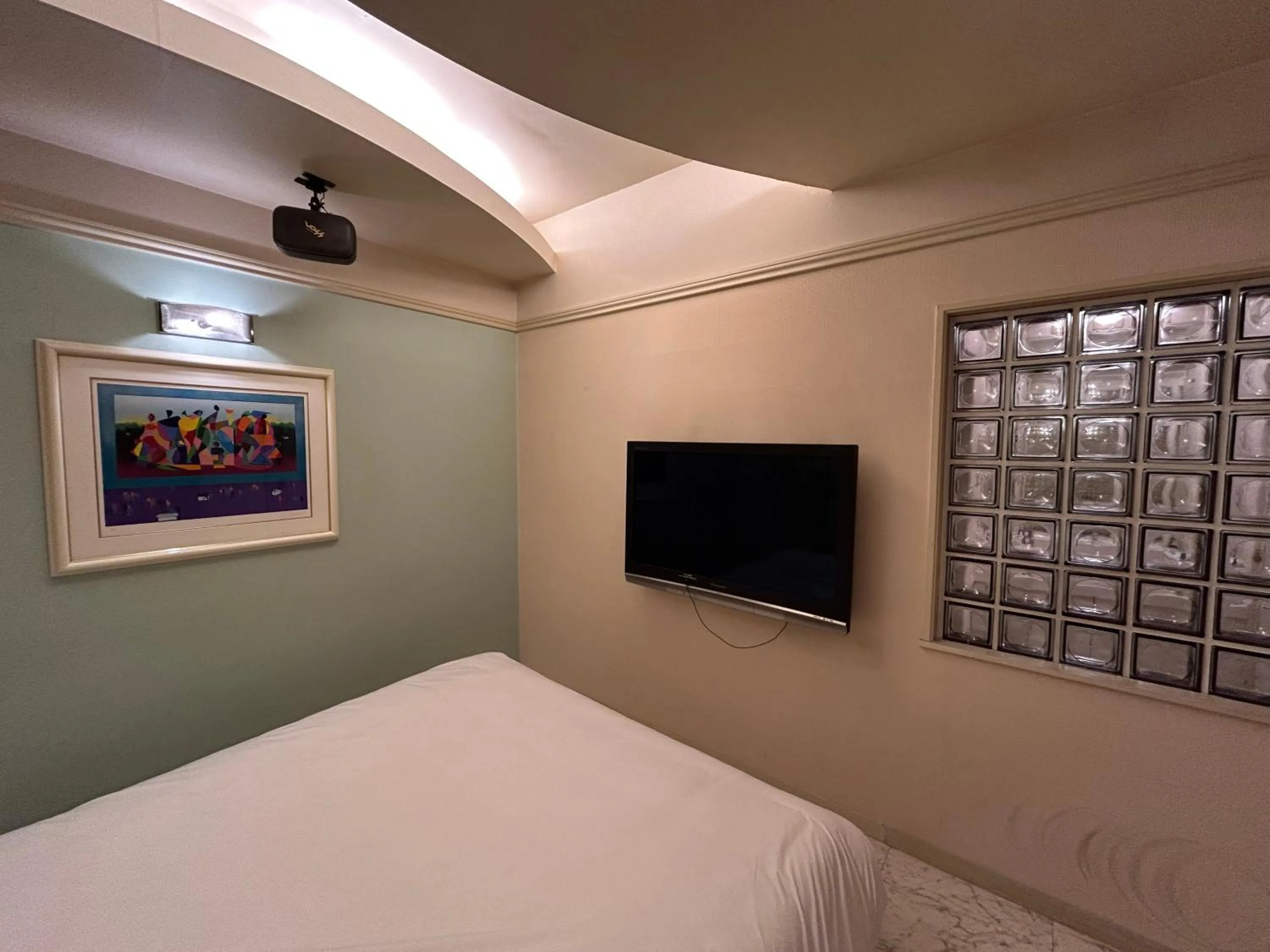 Bed in Hotel Takao Asile