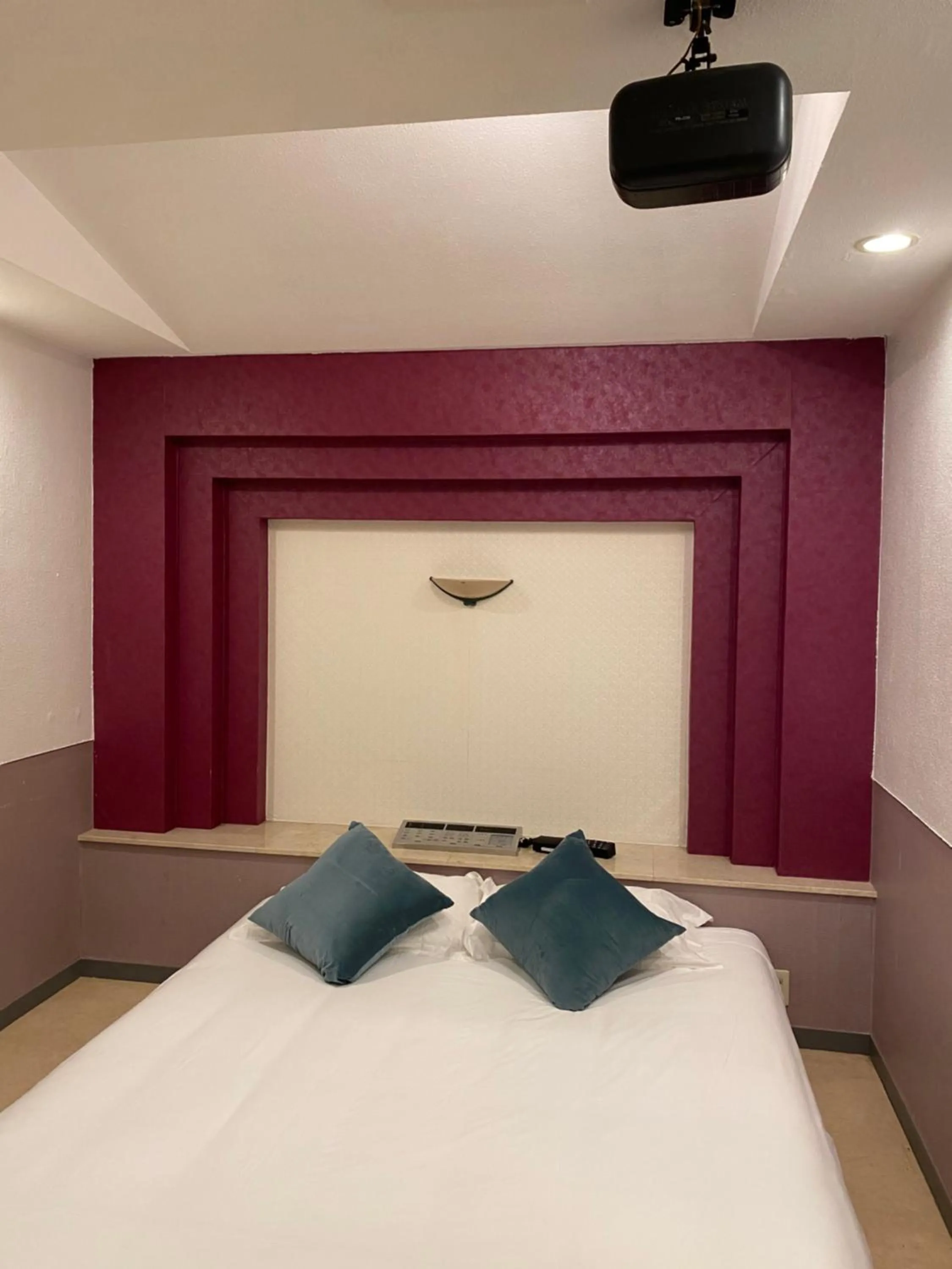 Bed in Hotel Takao Asile