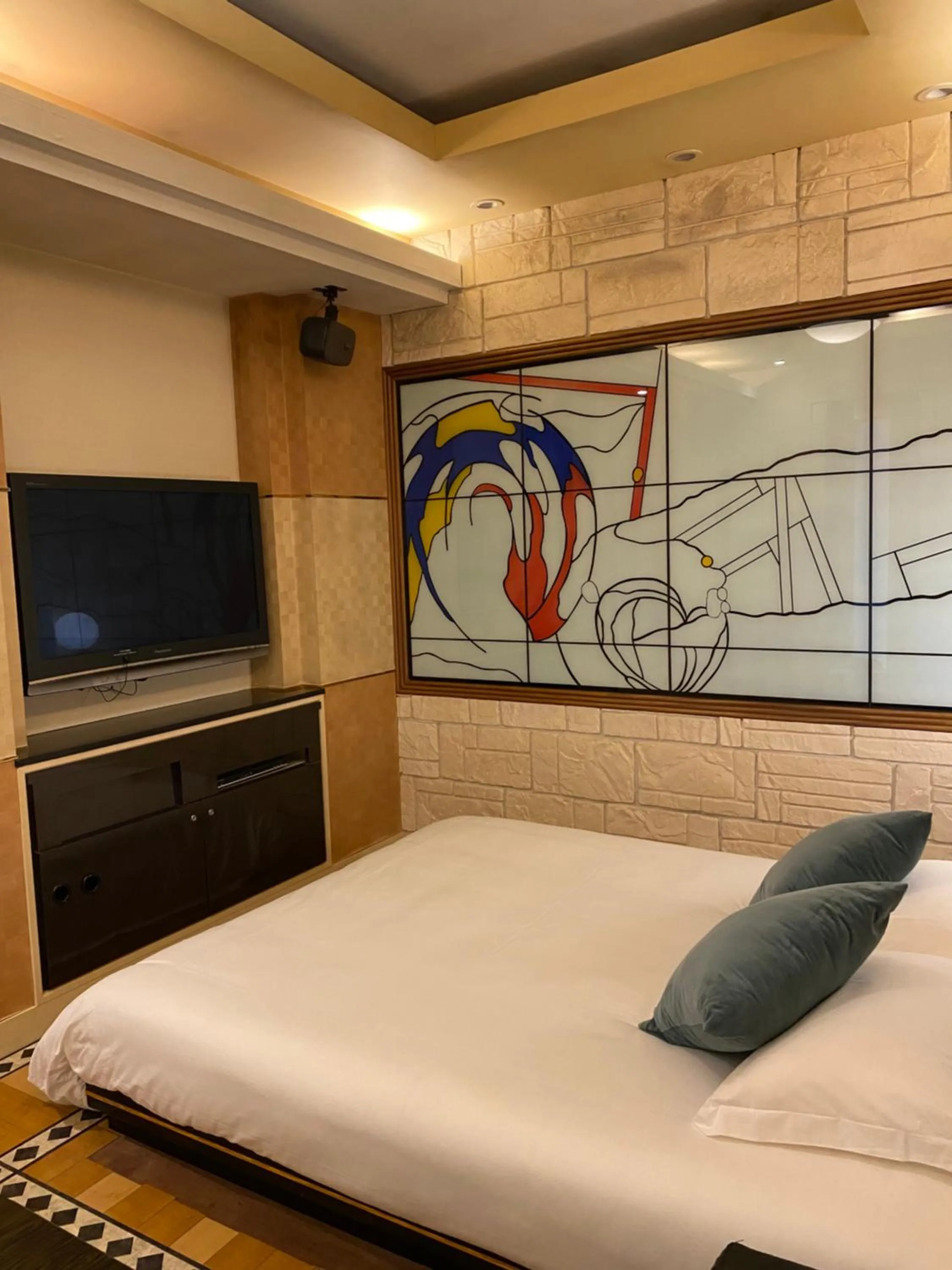 Bed in Hotel Takao Asile