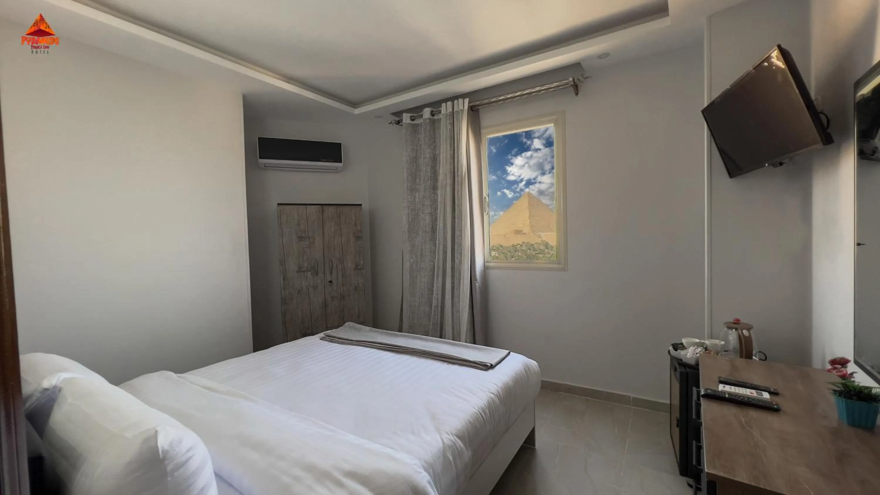 Bed in pyramids tower view inn