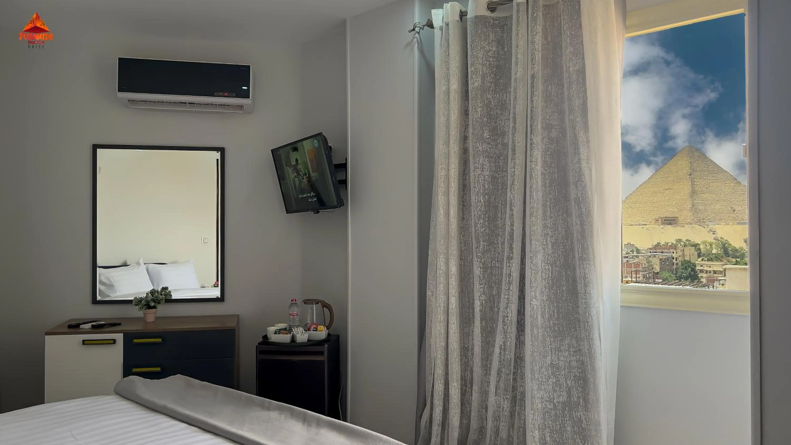 Bed in pyramids tower view inn