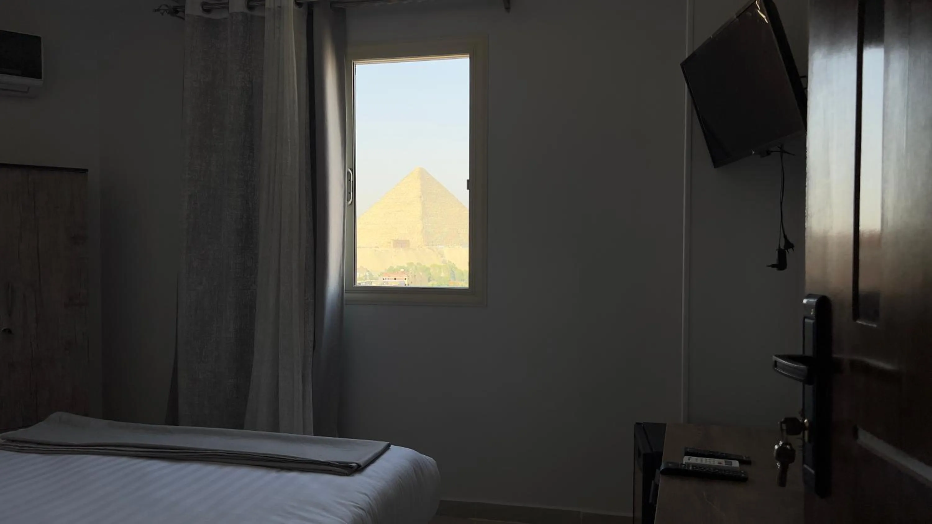 View (from property/room), Bed in pyramids tower view inn