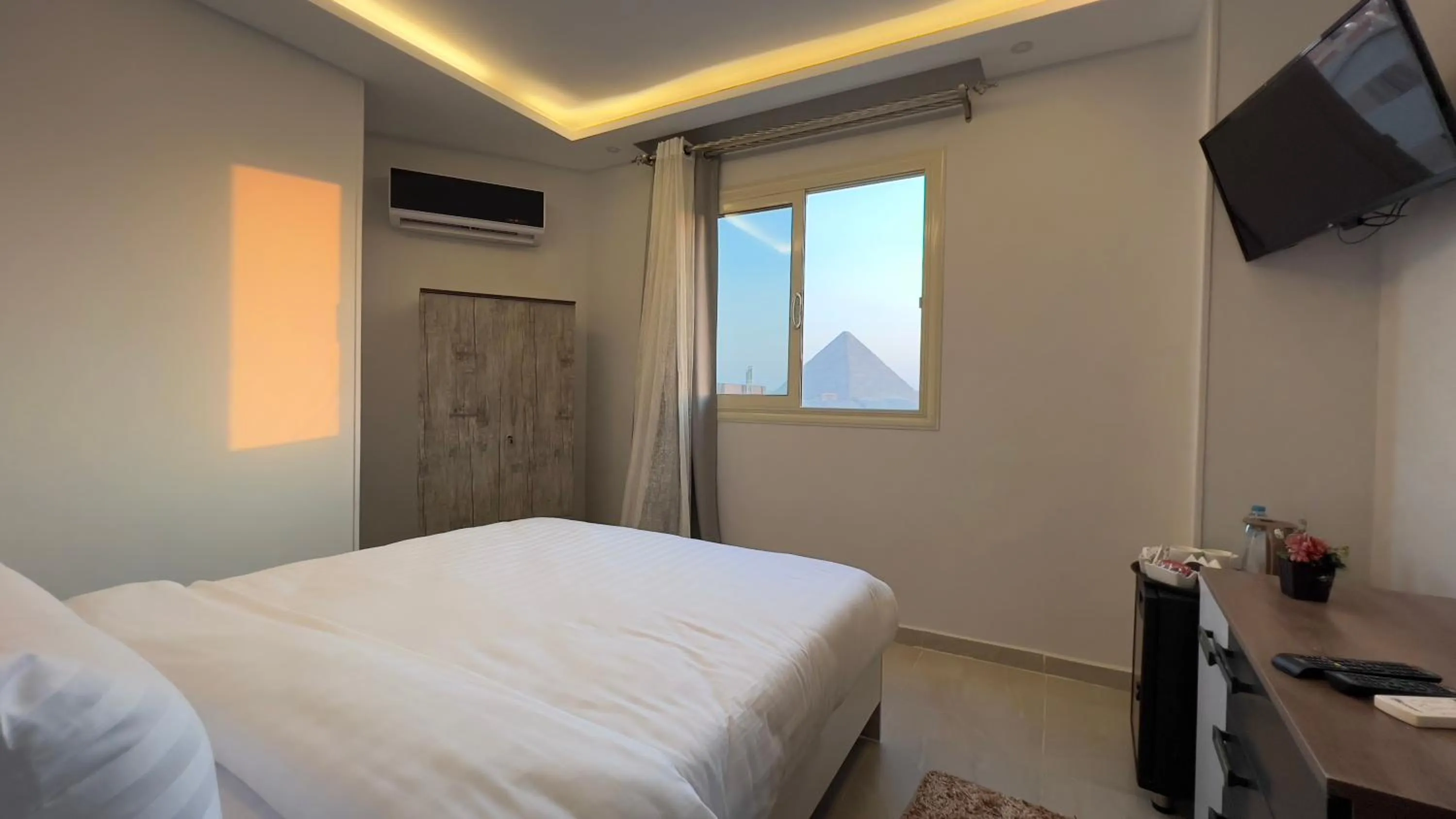 Bed in pyramids tower view inn