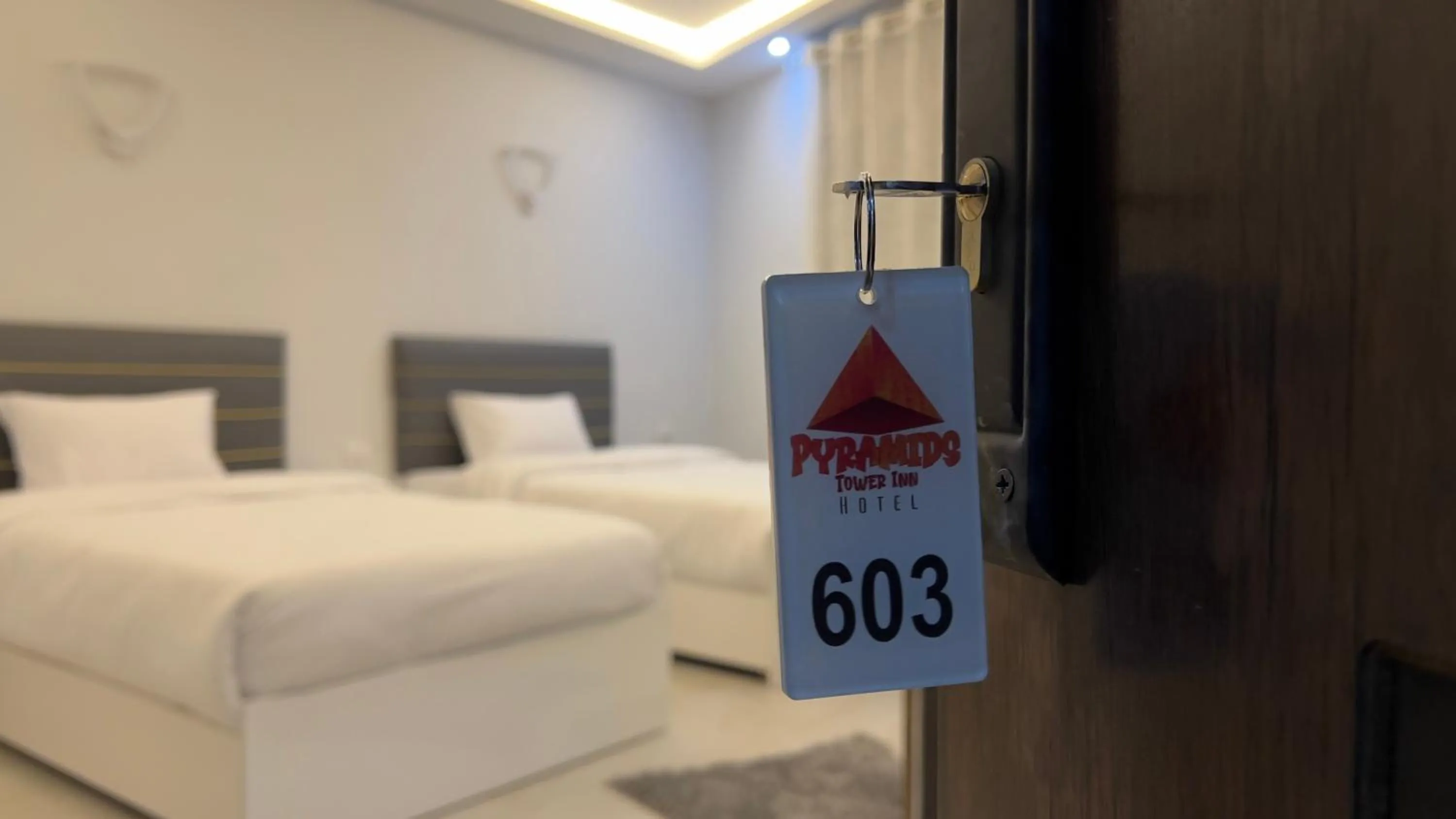 Bed in pyramids tower view inn