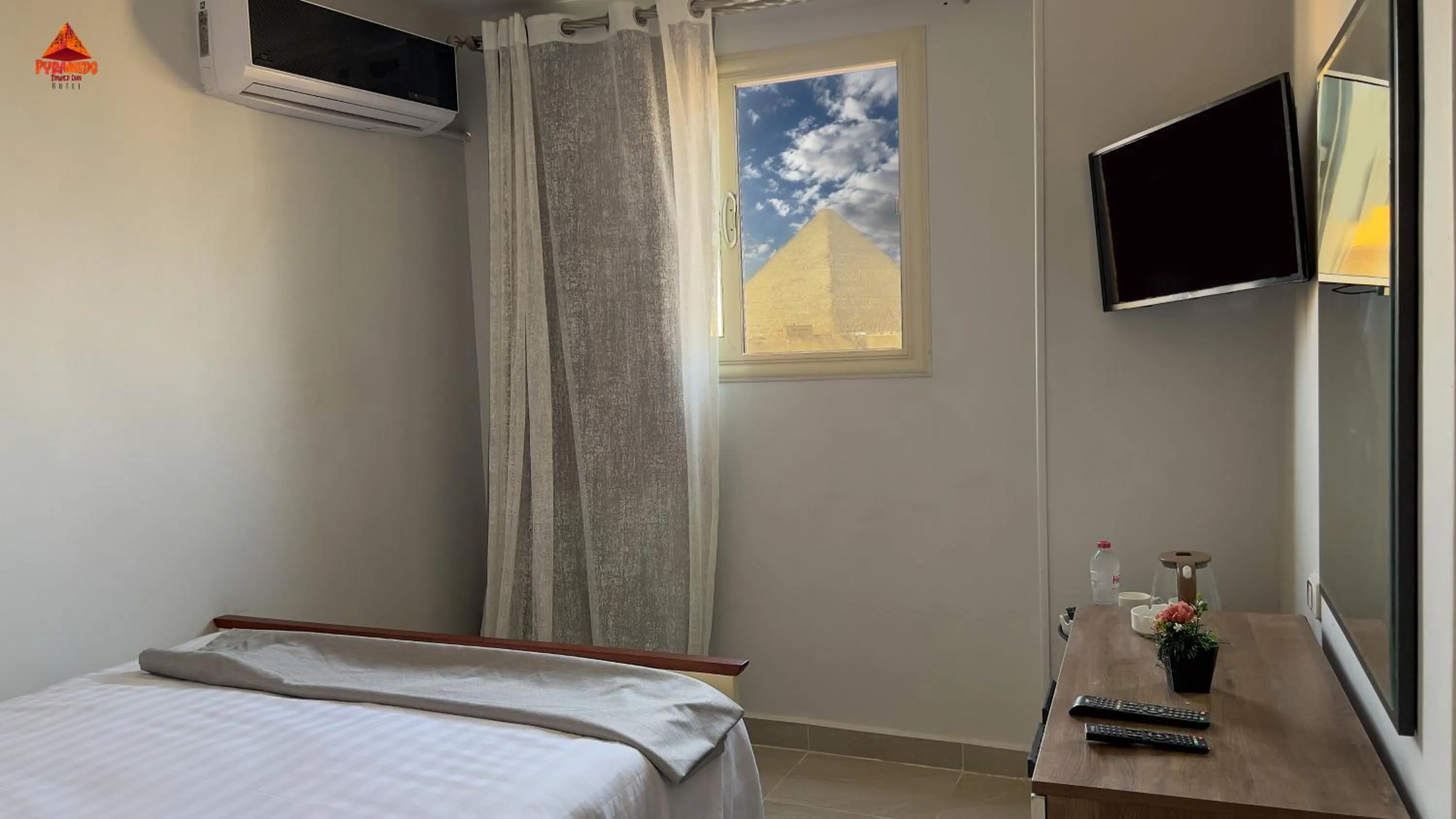 Photo of the whole room, Bed in pyramids tower view inn