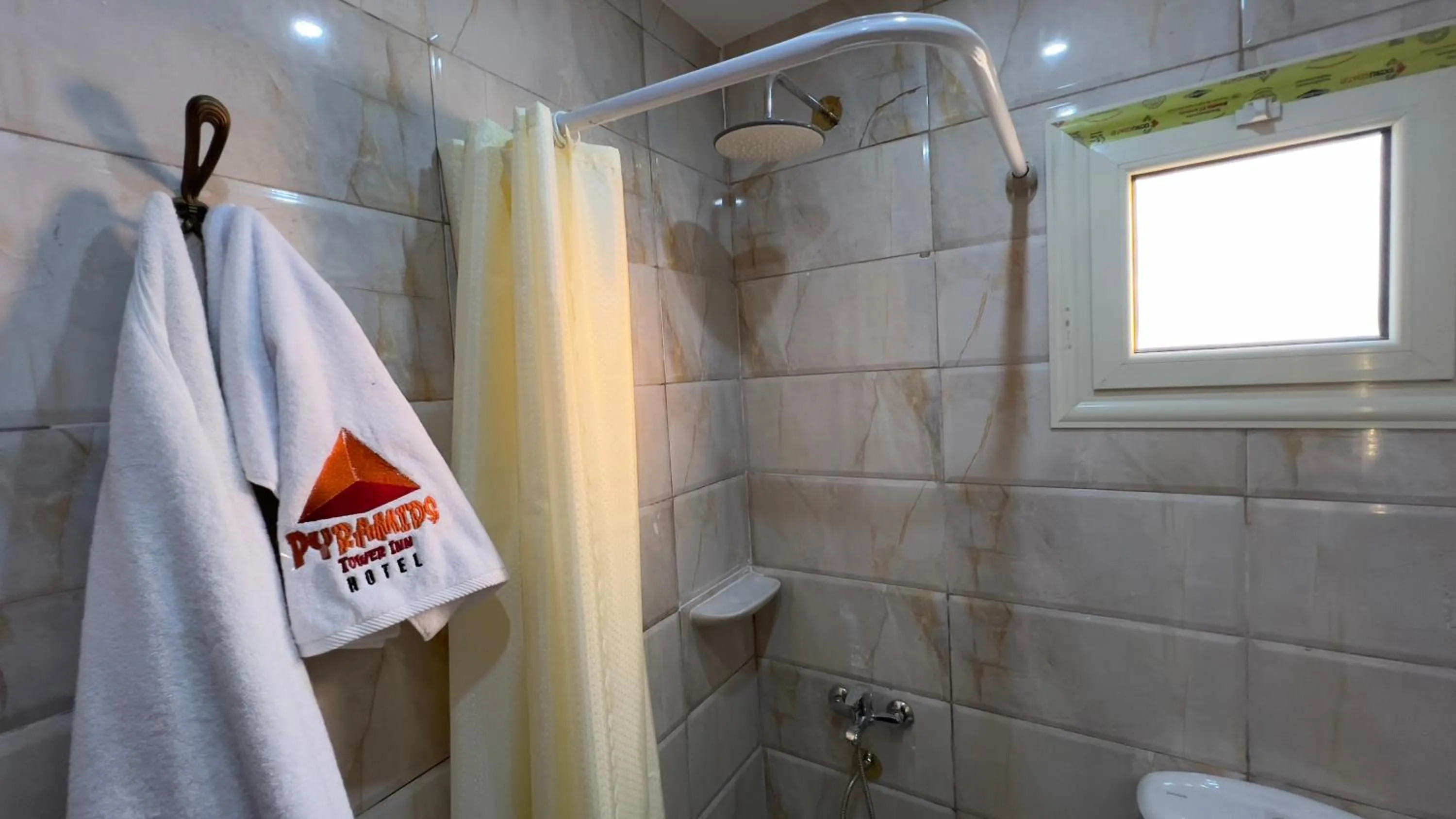 Shower in pyramids tower view inn