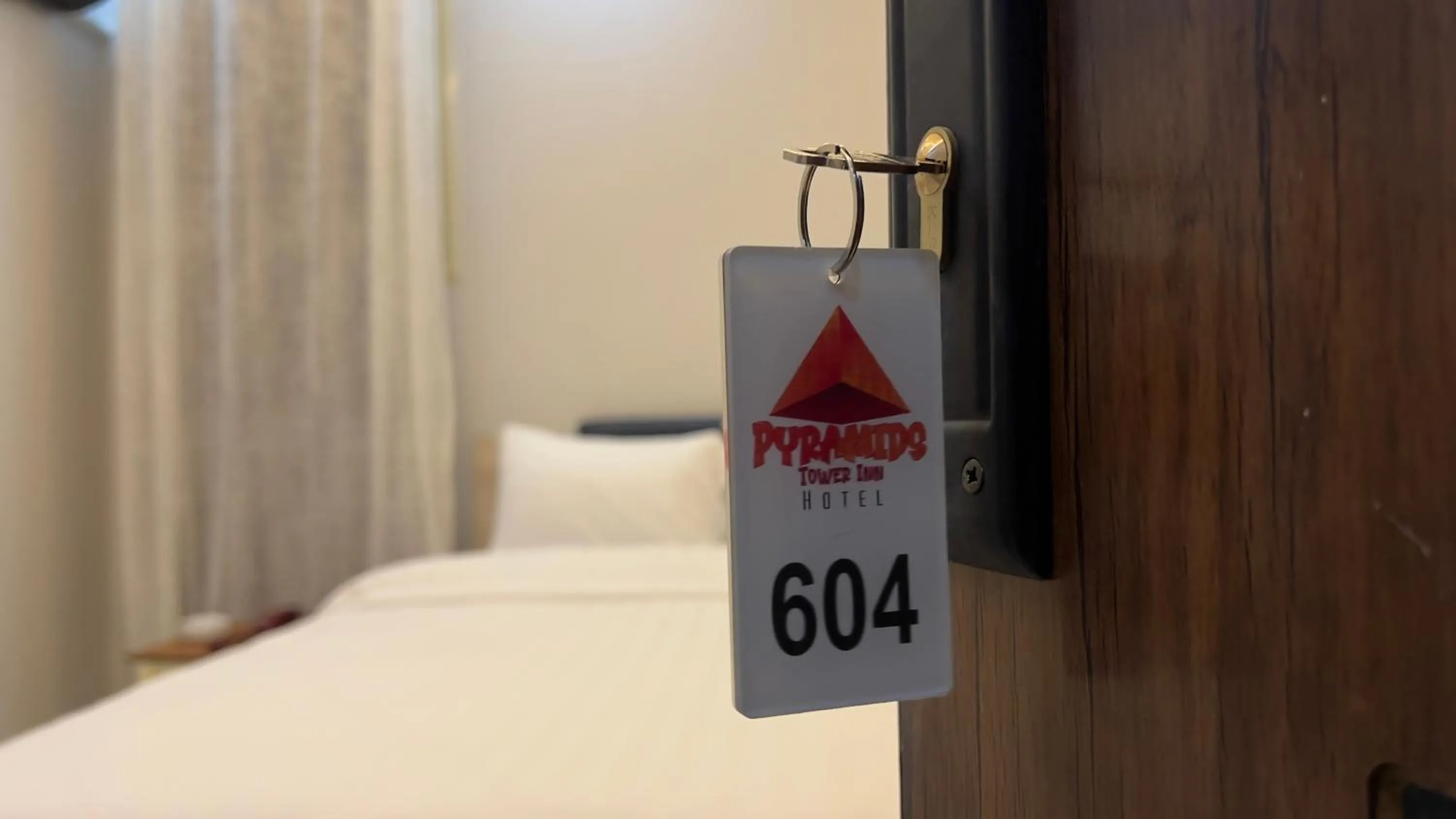 Bed in pyramids tower view inn