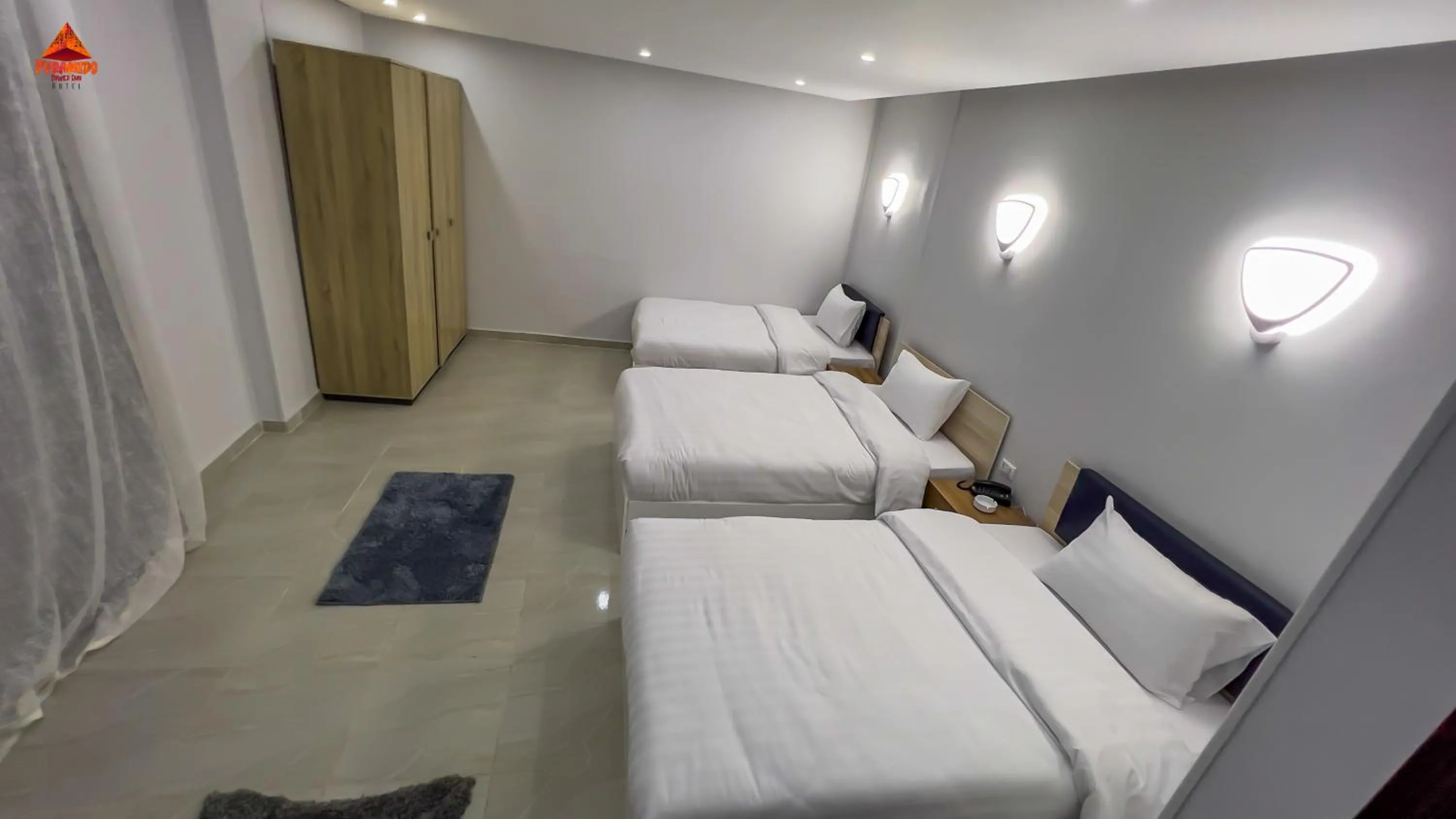 Bed in pyramids tower view inn