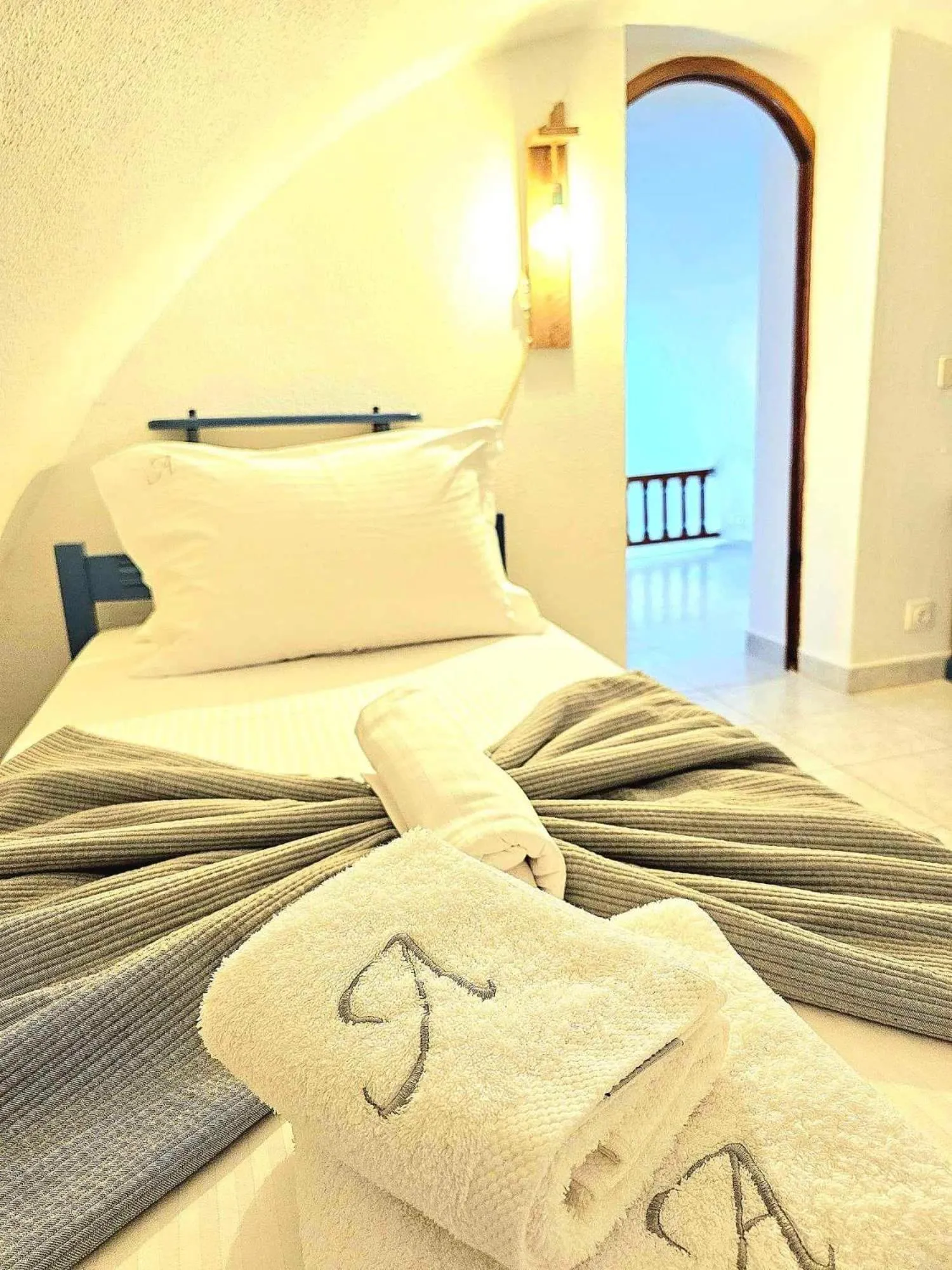 Bed in Amphitheater Cave Houses