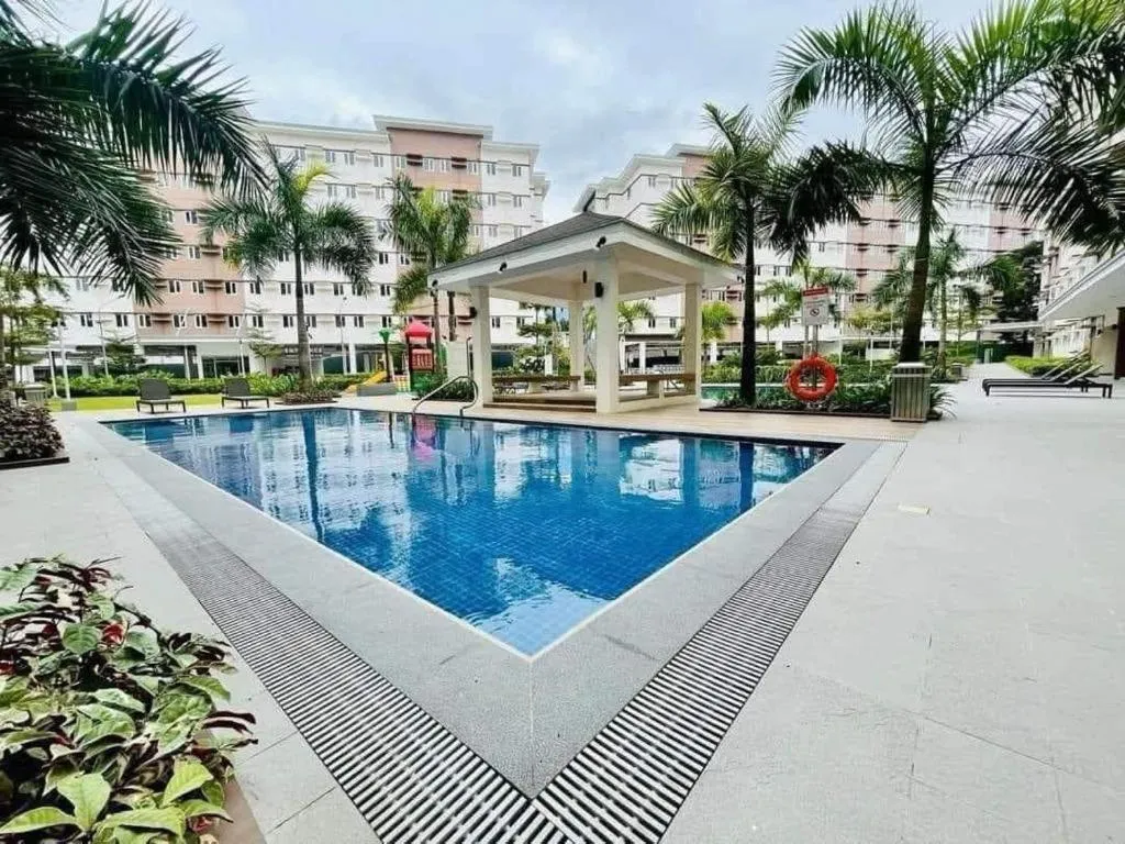 Swimming pool in Cozy Belle Suite Relaxing Place at SMDC Hope Residences
