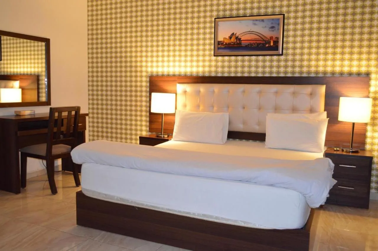 Bed in LANCASTER HOTEL APARTMENTS DAHIET ALRASHEED