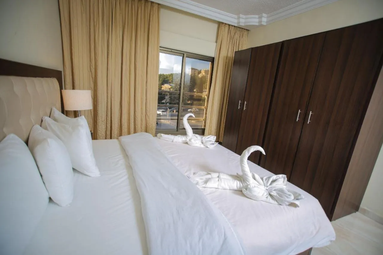 Bed in LANCASTER HOTEL APARTMENTS DAHIET ALRASHEED