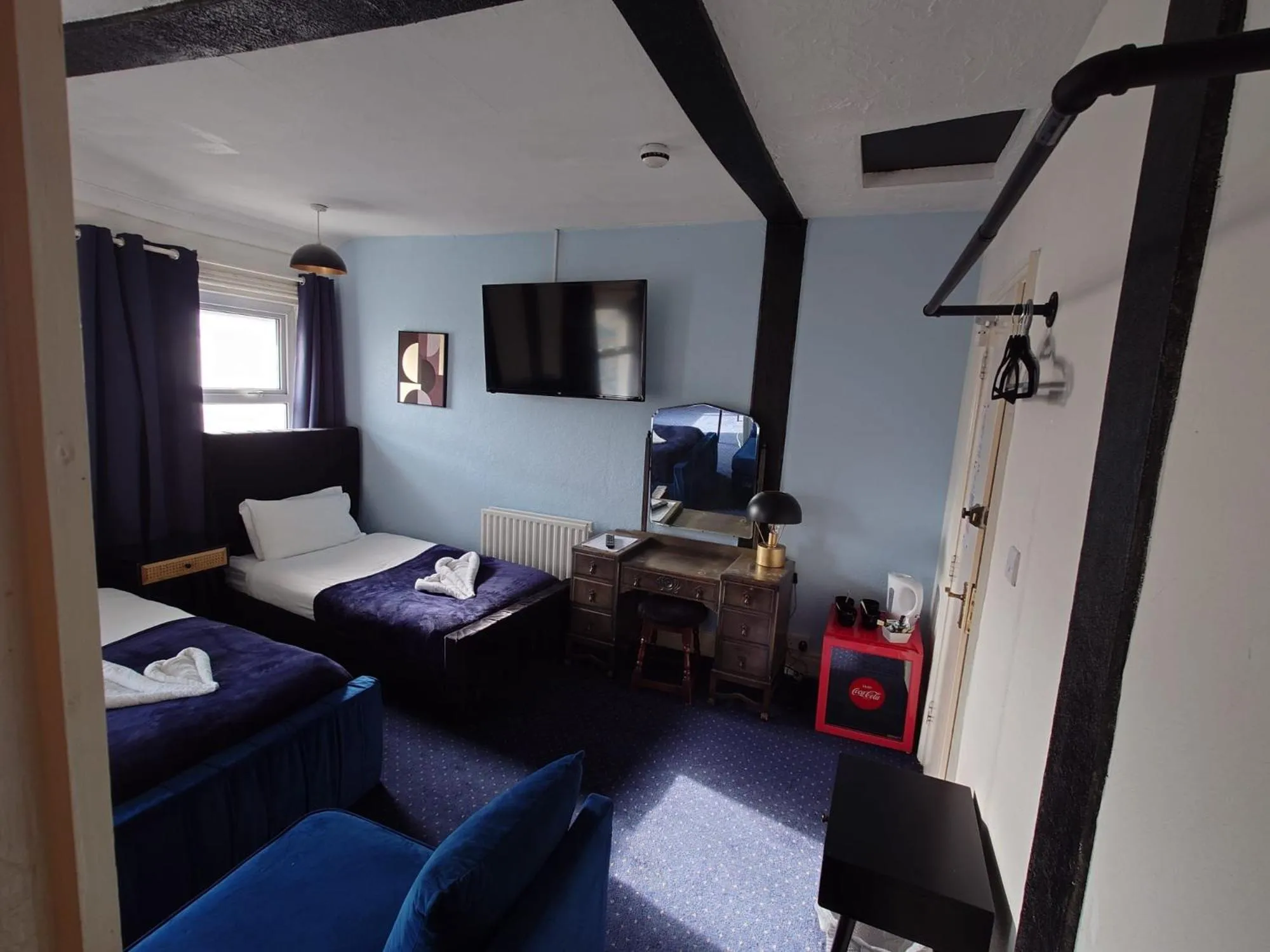 Bed in Harriette's Guest House