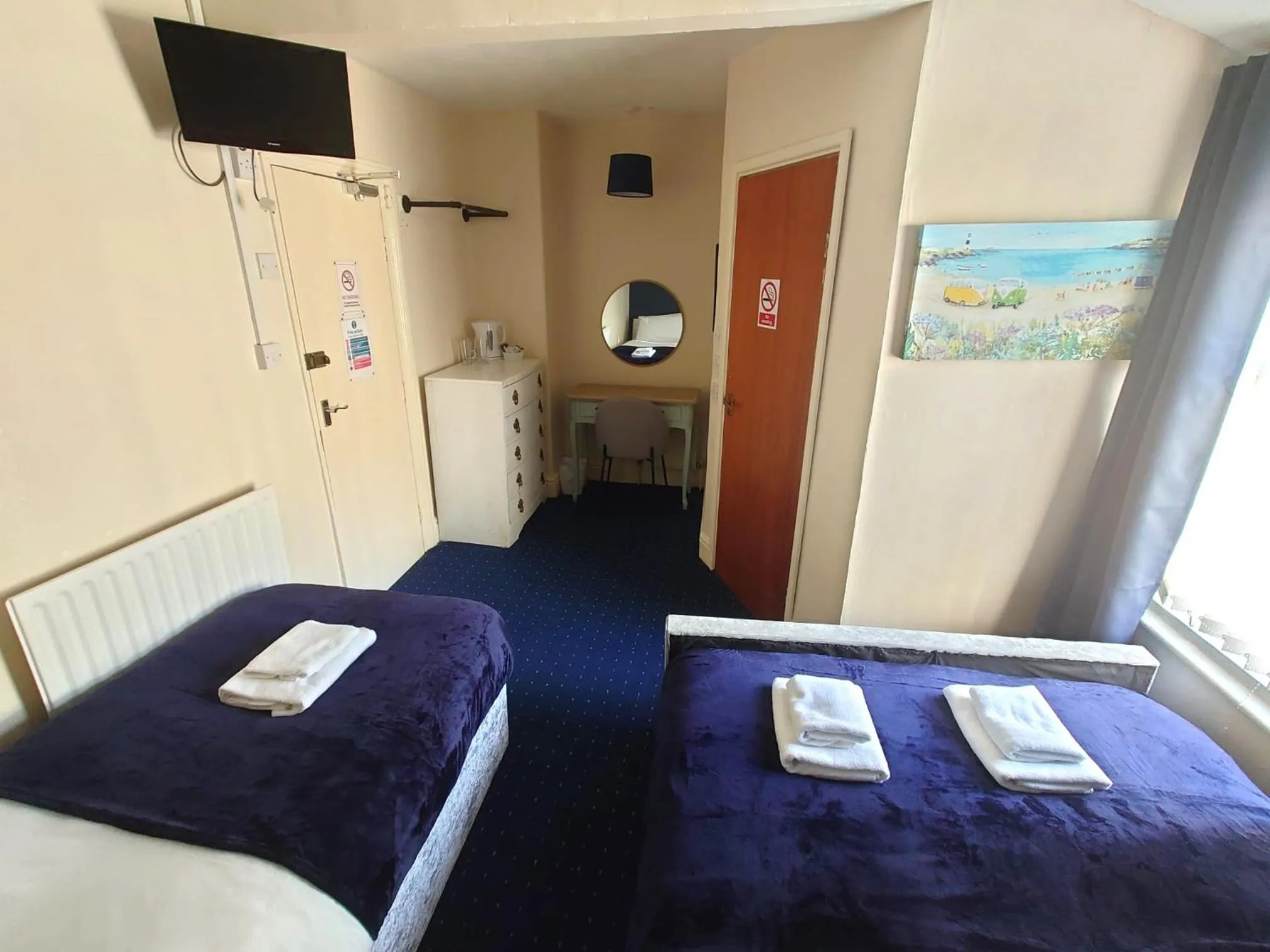 Bed in Harriette's Guest House