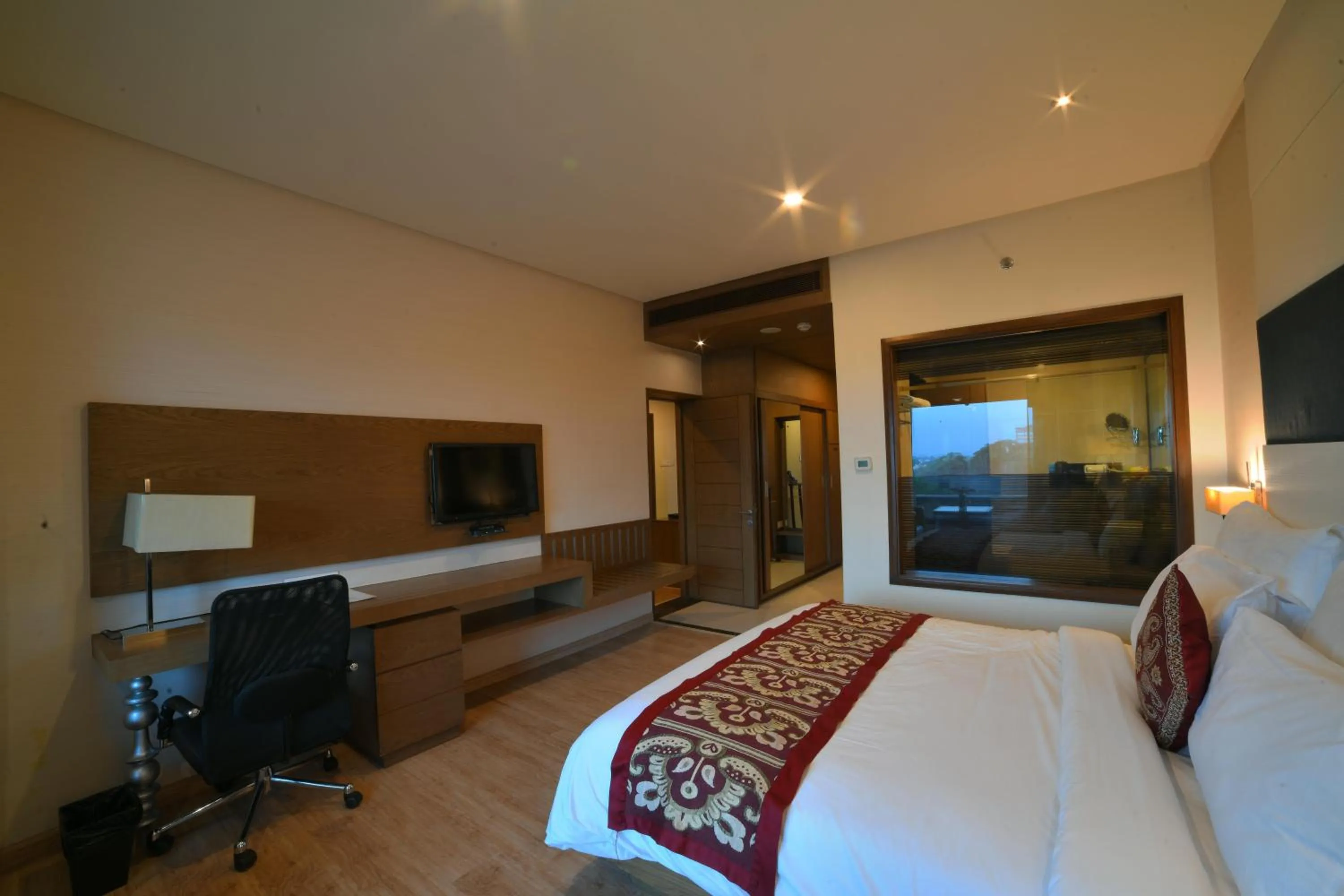 Communal lounge/ TV room, Bed in Narayani Heights Hotel & Resort