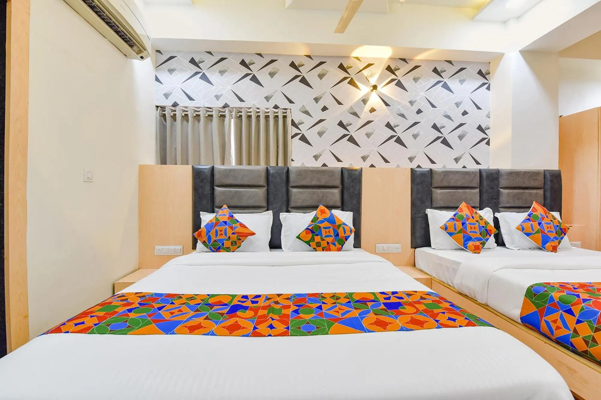 Bed in FabHotel Symphony Grand