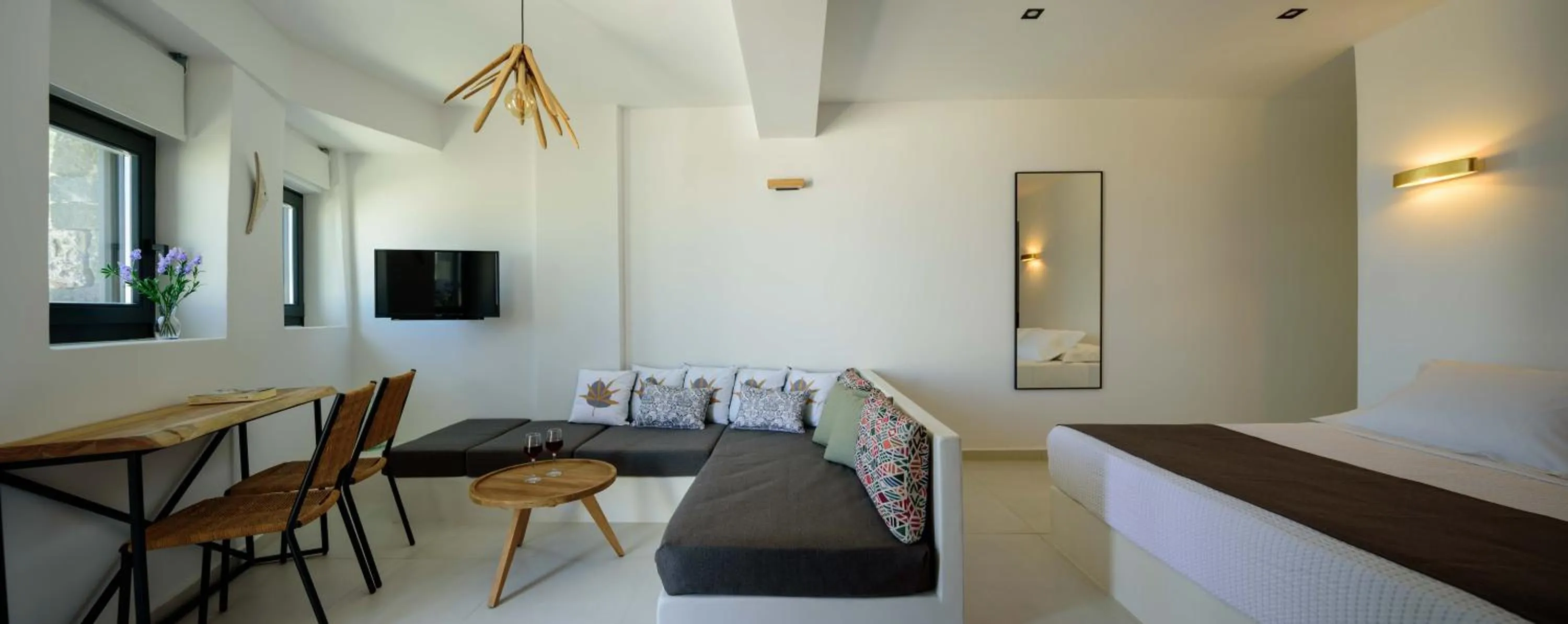 Seating area, Bed in Ryolithos Suites