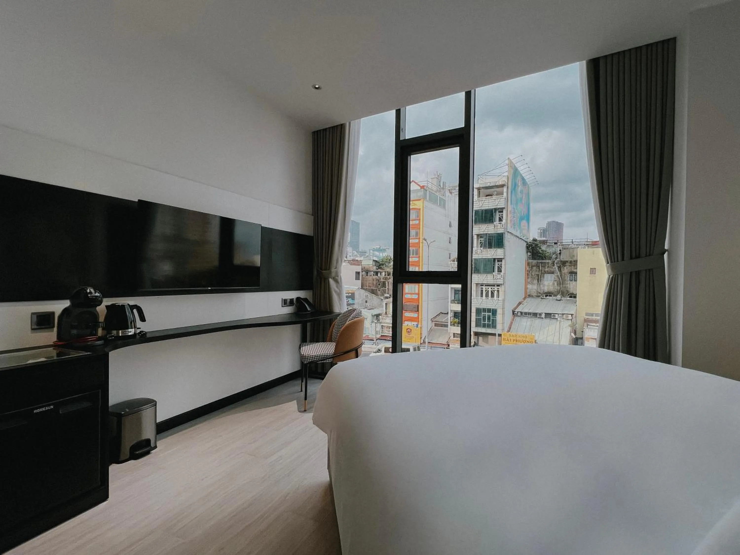View (from property/room), Bed in The Concept Hotel HCMC- District 1