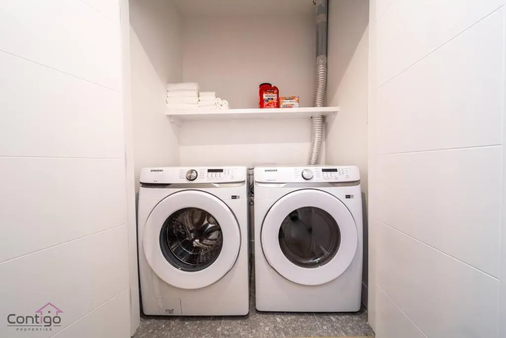 washing machine in Luxe New York Style Bsmt Suite, Near DT & WEM, King Bed, WiFi
