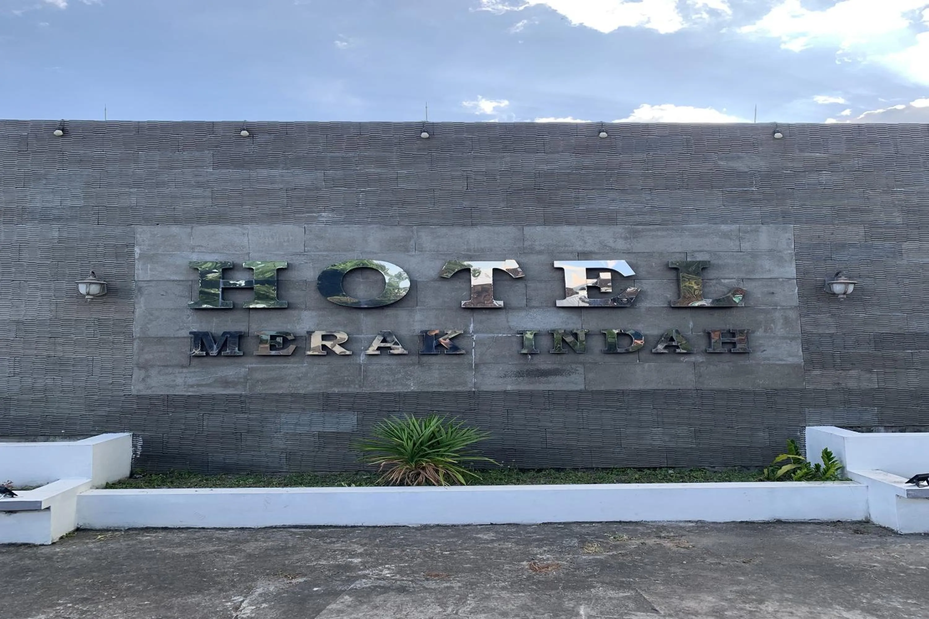 Property logo or sign in Hotel Merak Indah