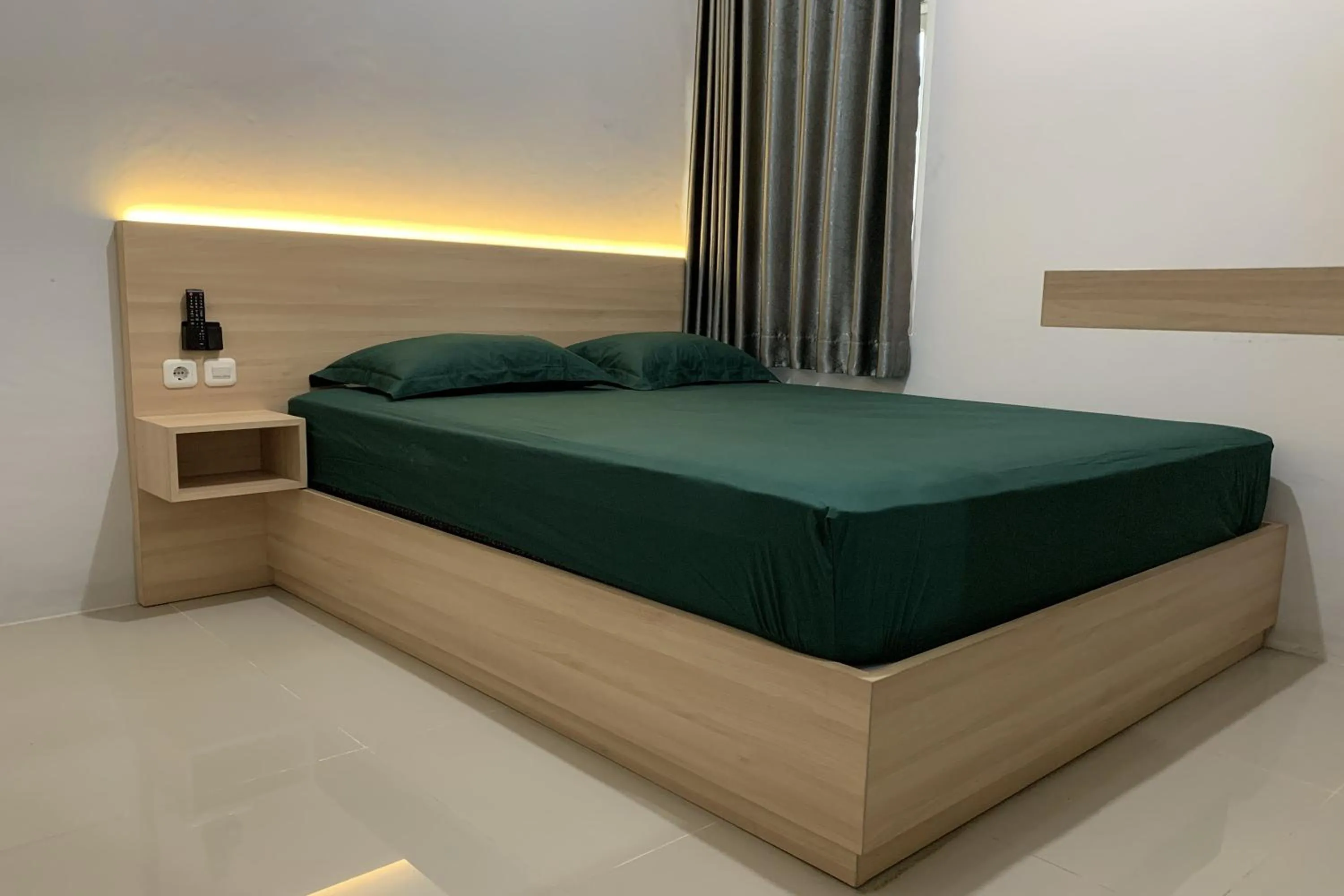 Bed in Hotel Merak Indah