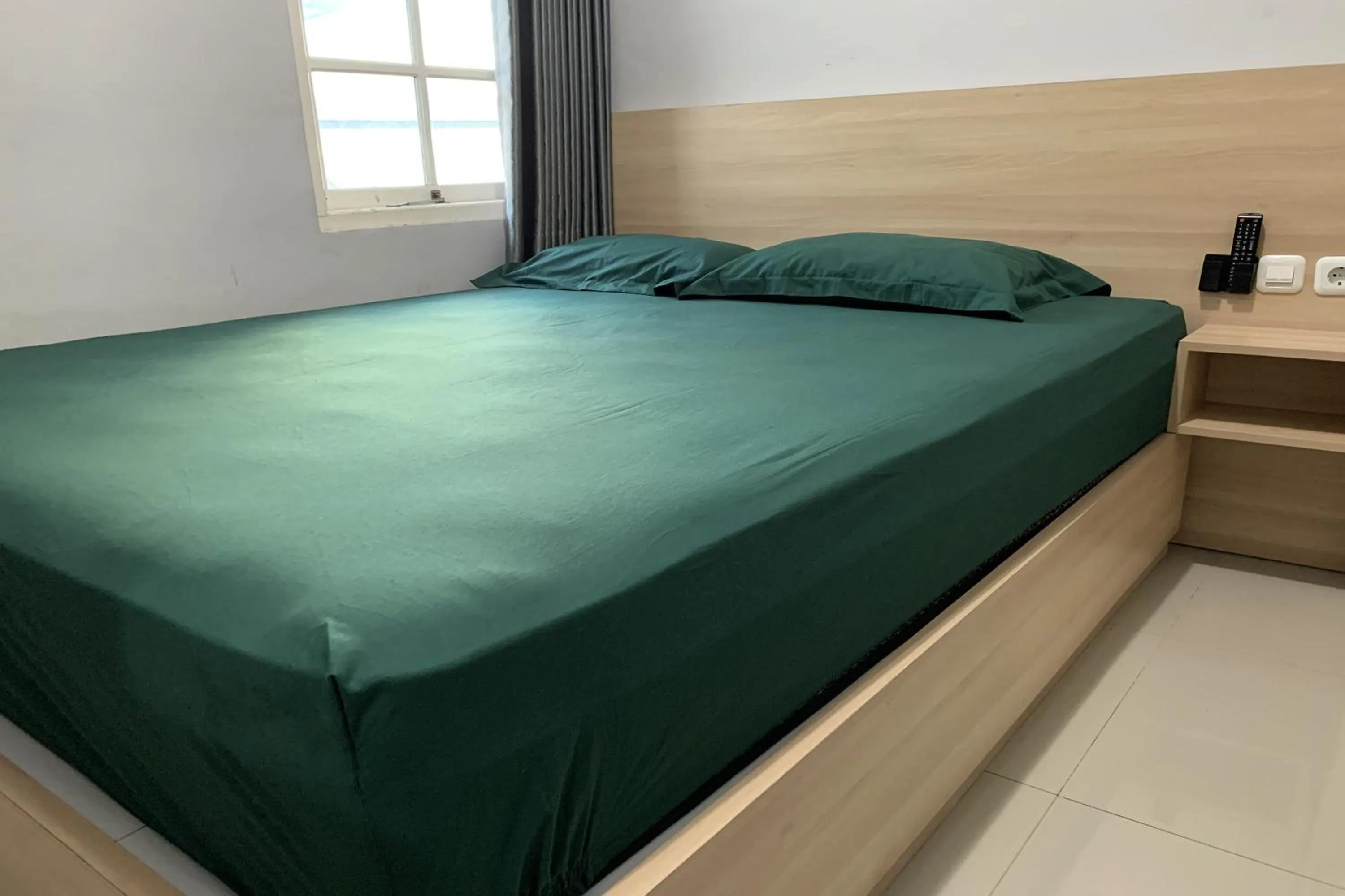 Bed in Hotel Merak Indah