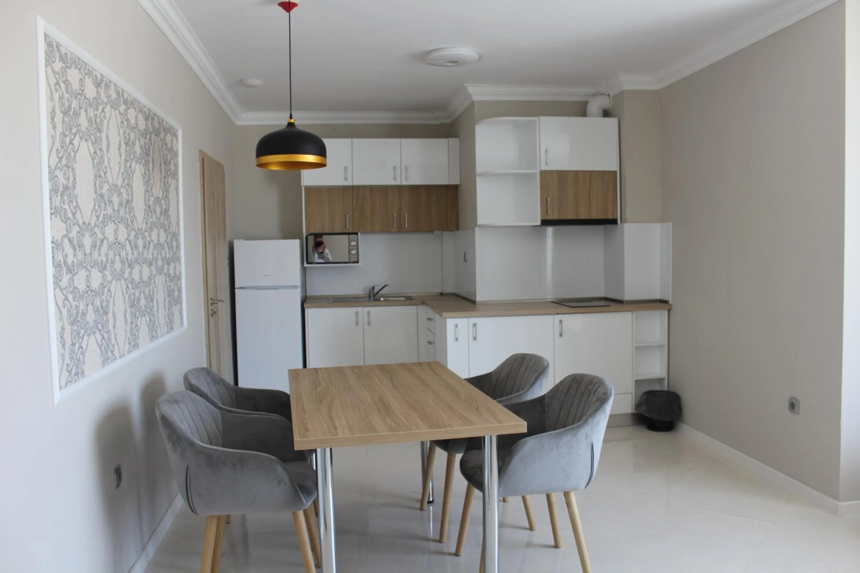 Kitchen or kitchenette in Vemara City Boutique Hotel-free parking