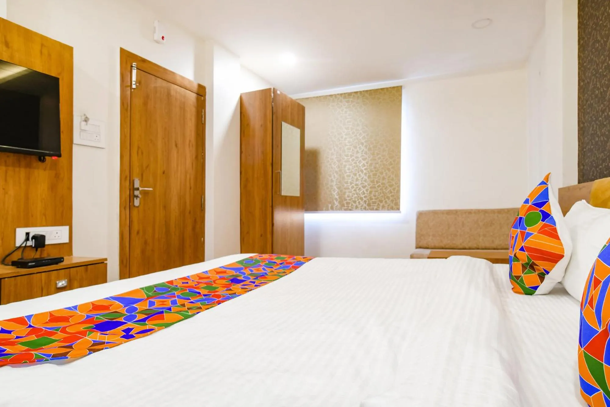 Bed in FabHotel Woodlark Inn