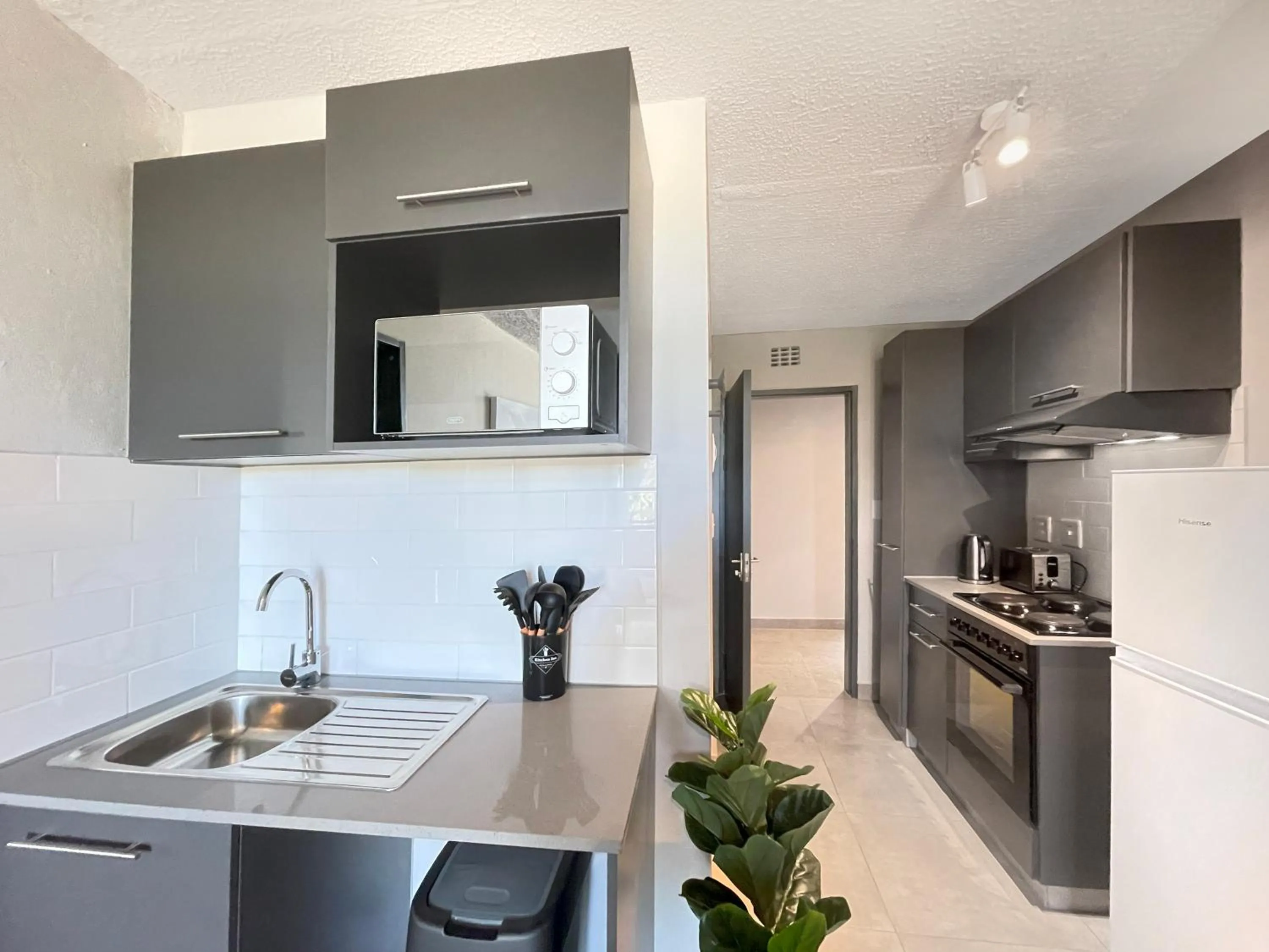 Kitchen or kitchenette in Circa Aparthotel by Totalstay
