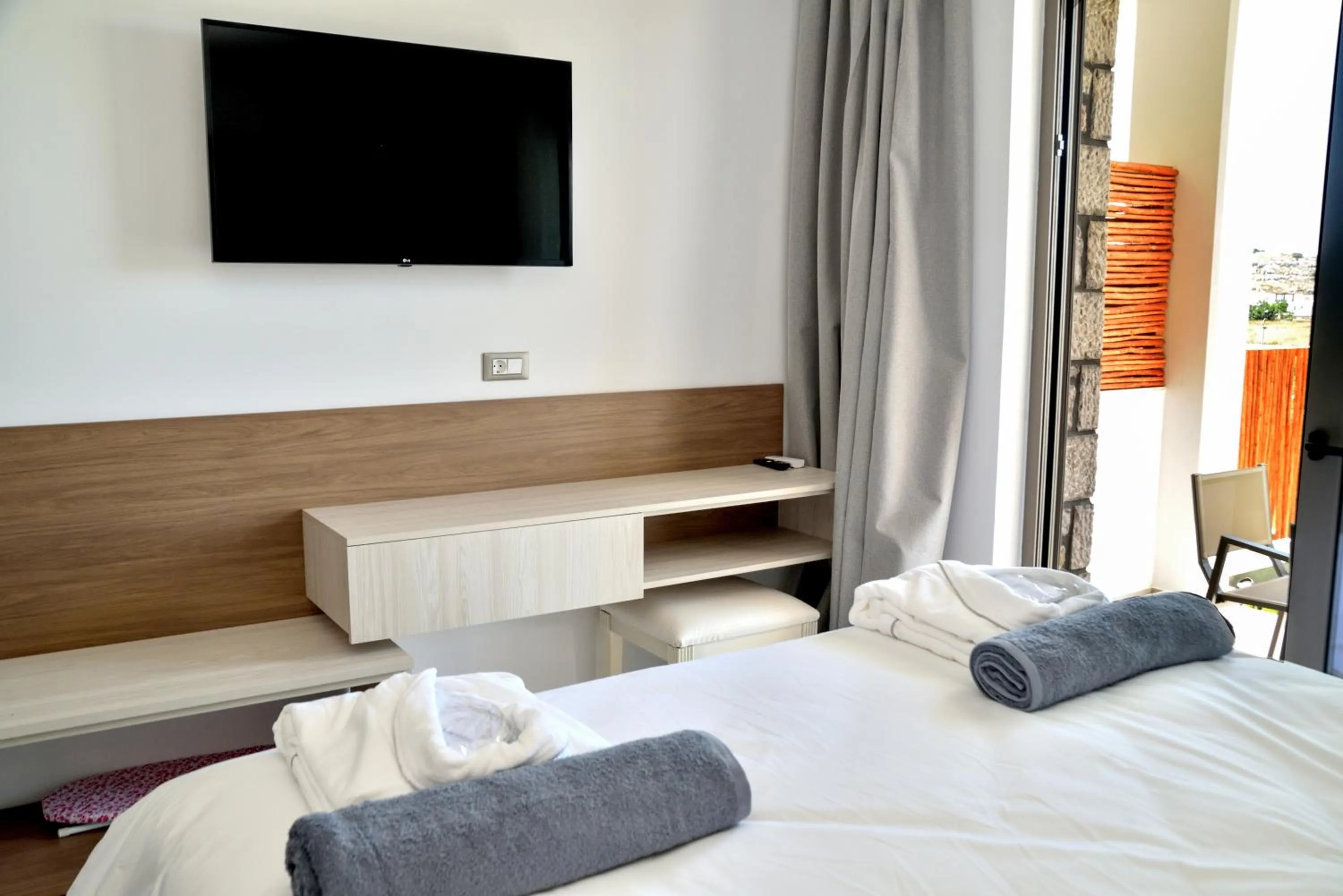 Bed in KOUROS STONE SUITES