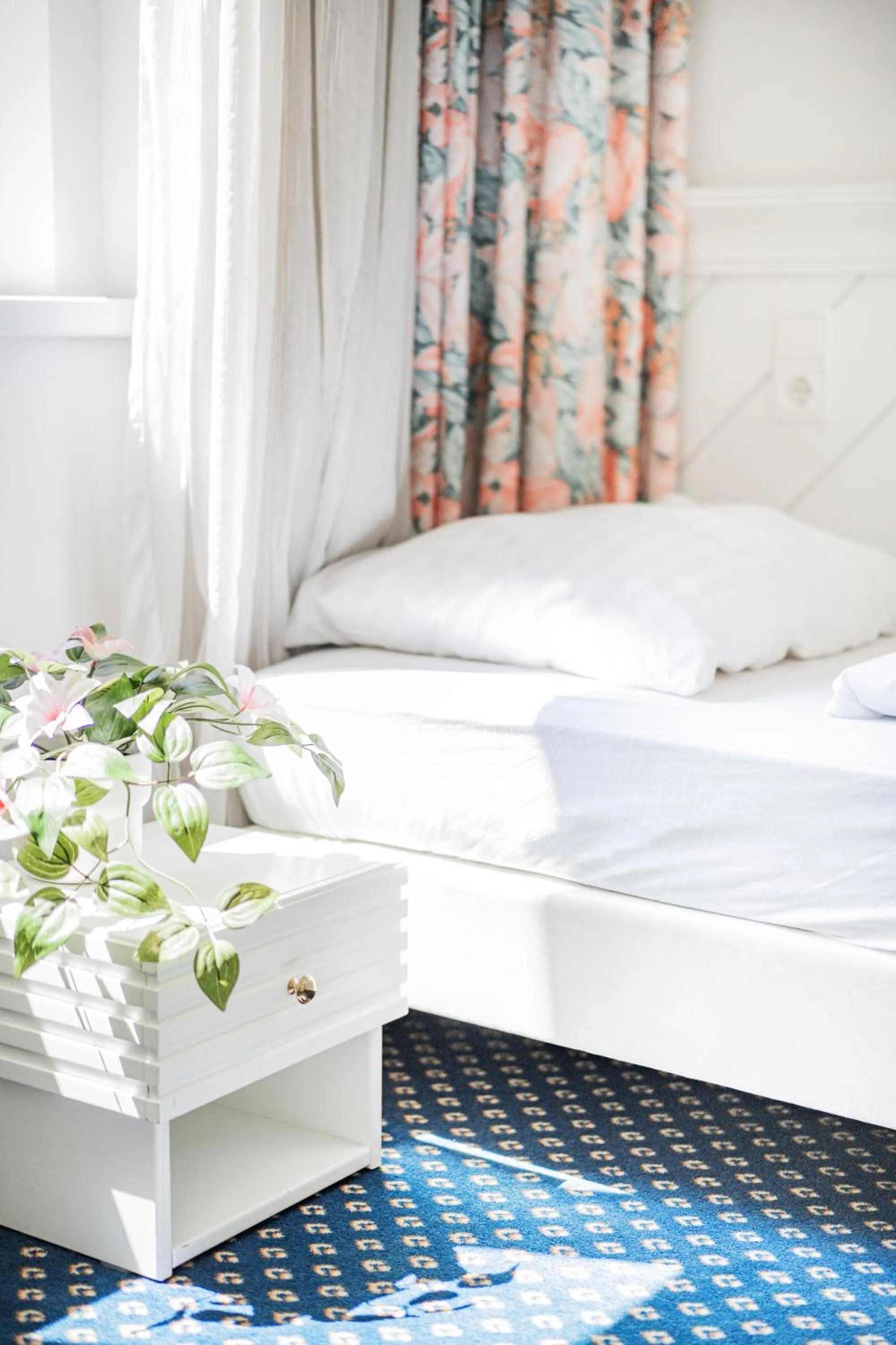 Bed in Self-Check-In Hotel Adlon