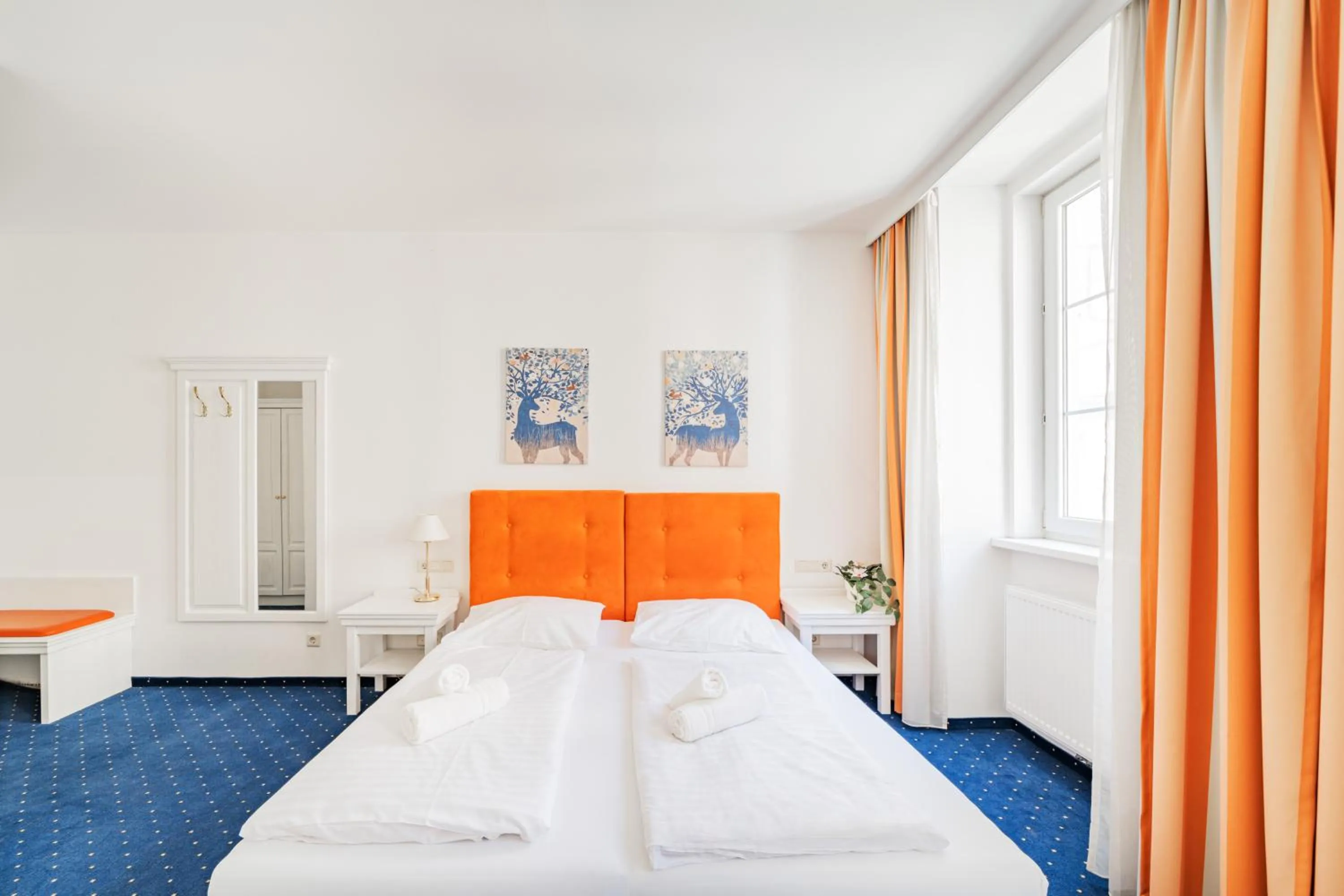 Bed in Self-Check-In Hotel Adlon