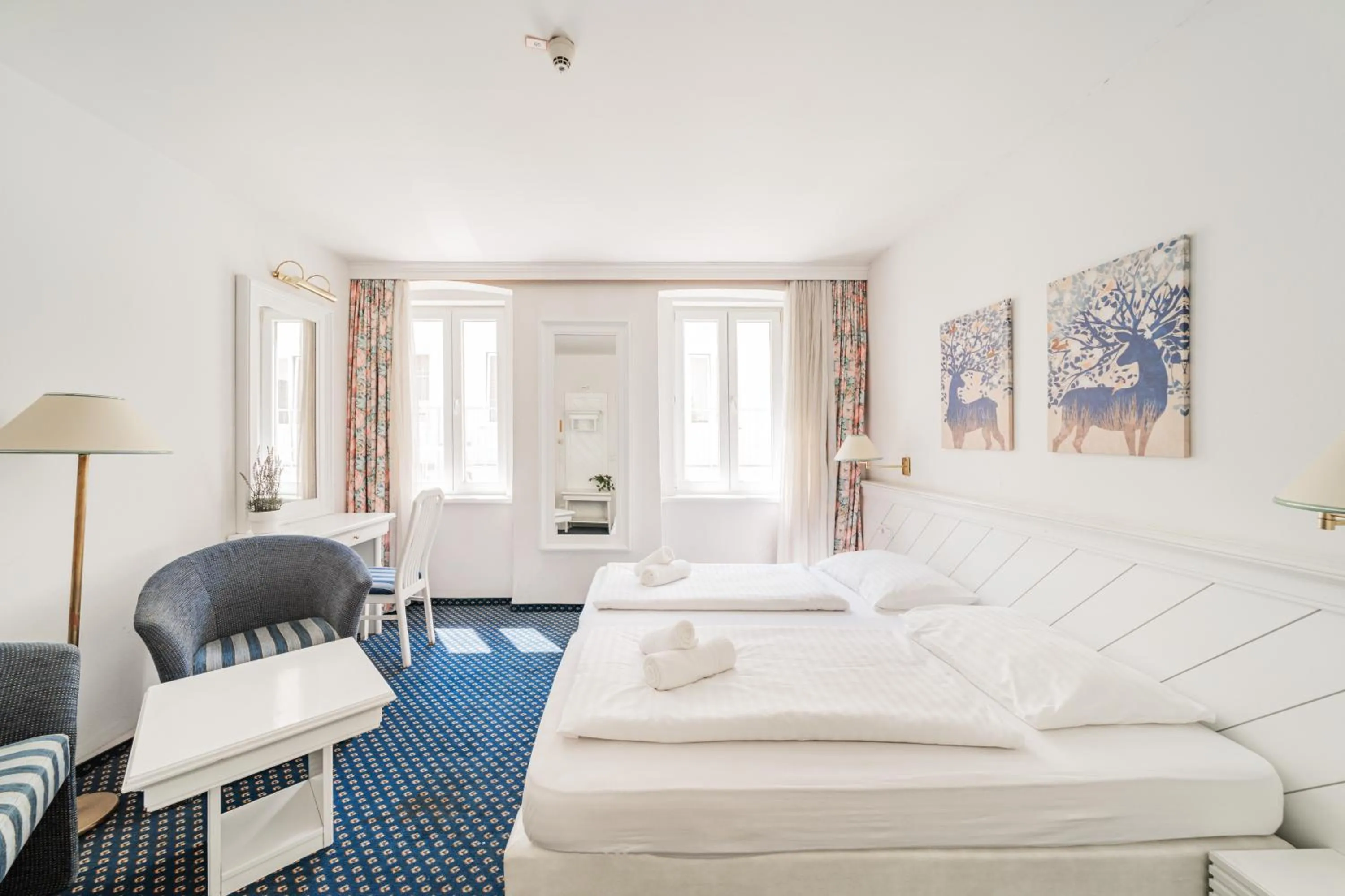 Bed in Self-Check-In Hotel Adlon