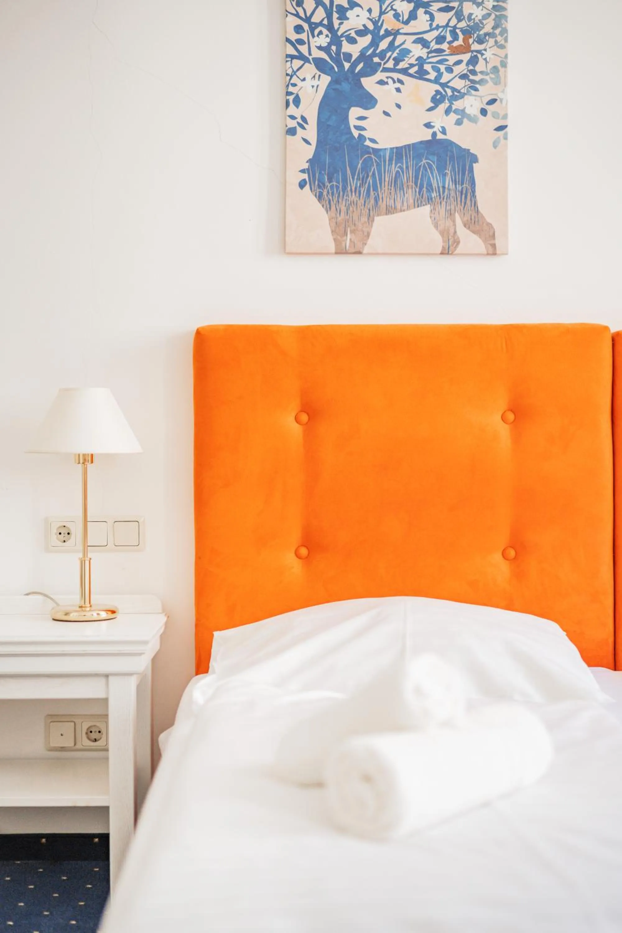 Bed in Self-Check-In Hotel Adlon