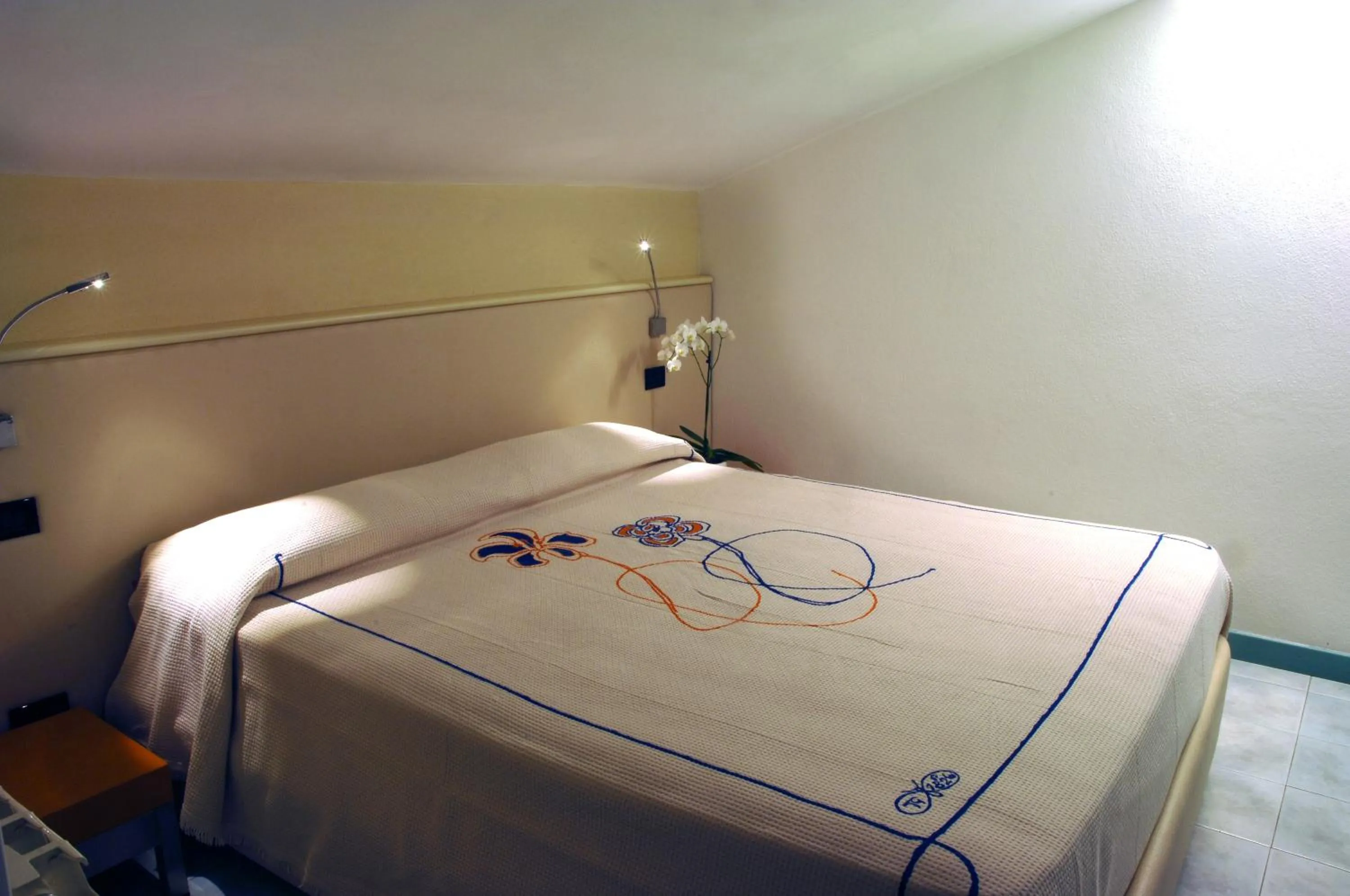 Bed in Hotel Eros Residence