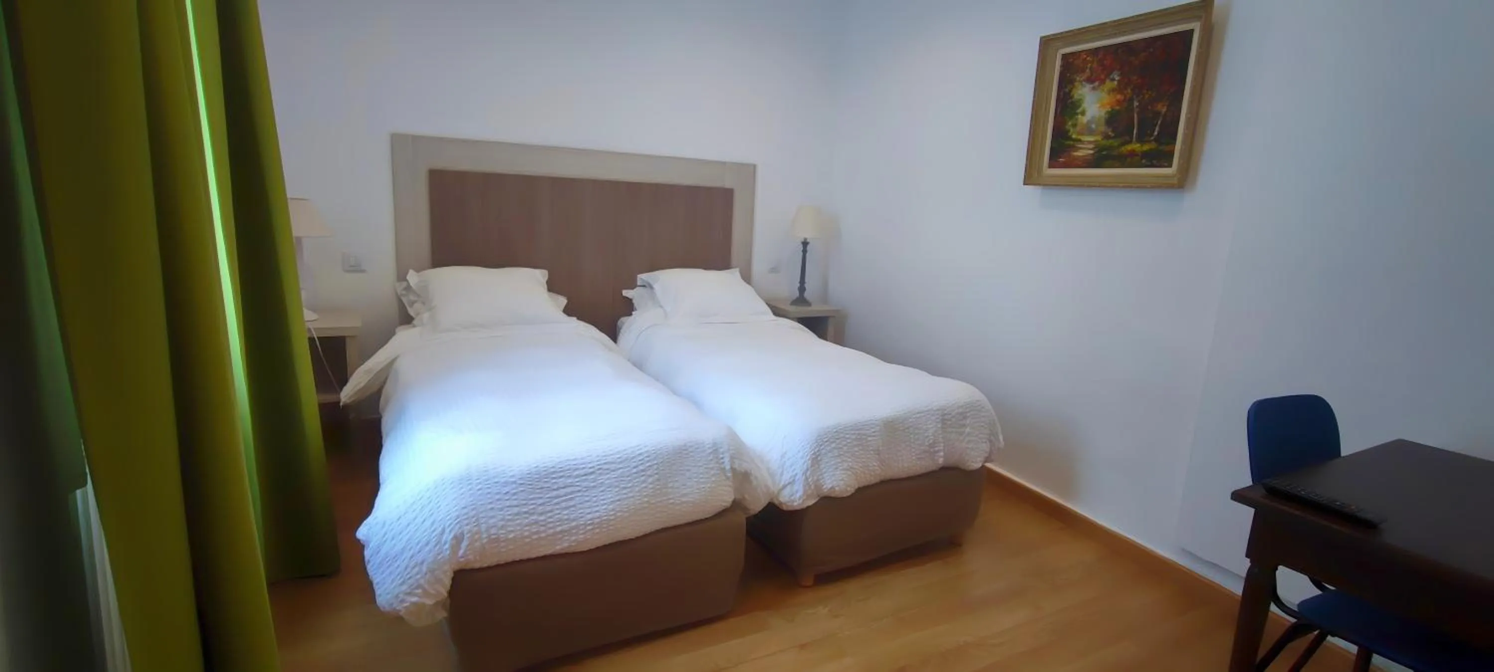 Bed in Logis Grand Hotel Pelisson