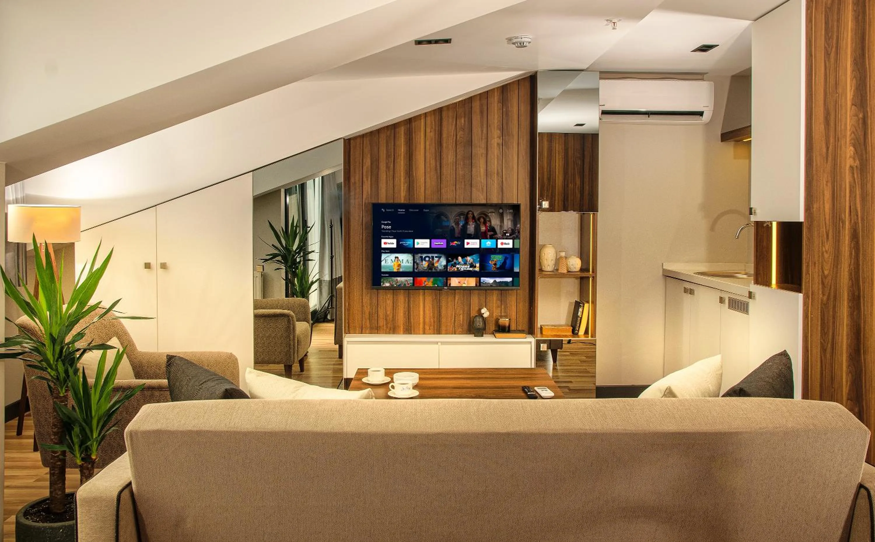 Communal lounge/ TV room in La Mia Suites