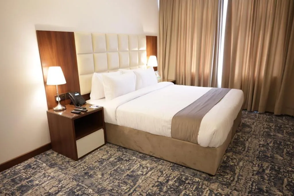 Bed in Dolphin Continental Hotel